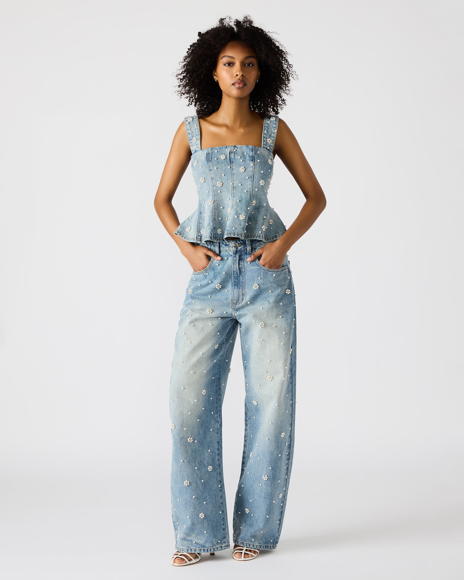 Back view of denim cargo pants showing pocket details and wide-leg cut