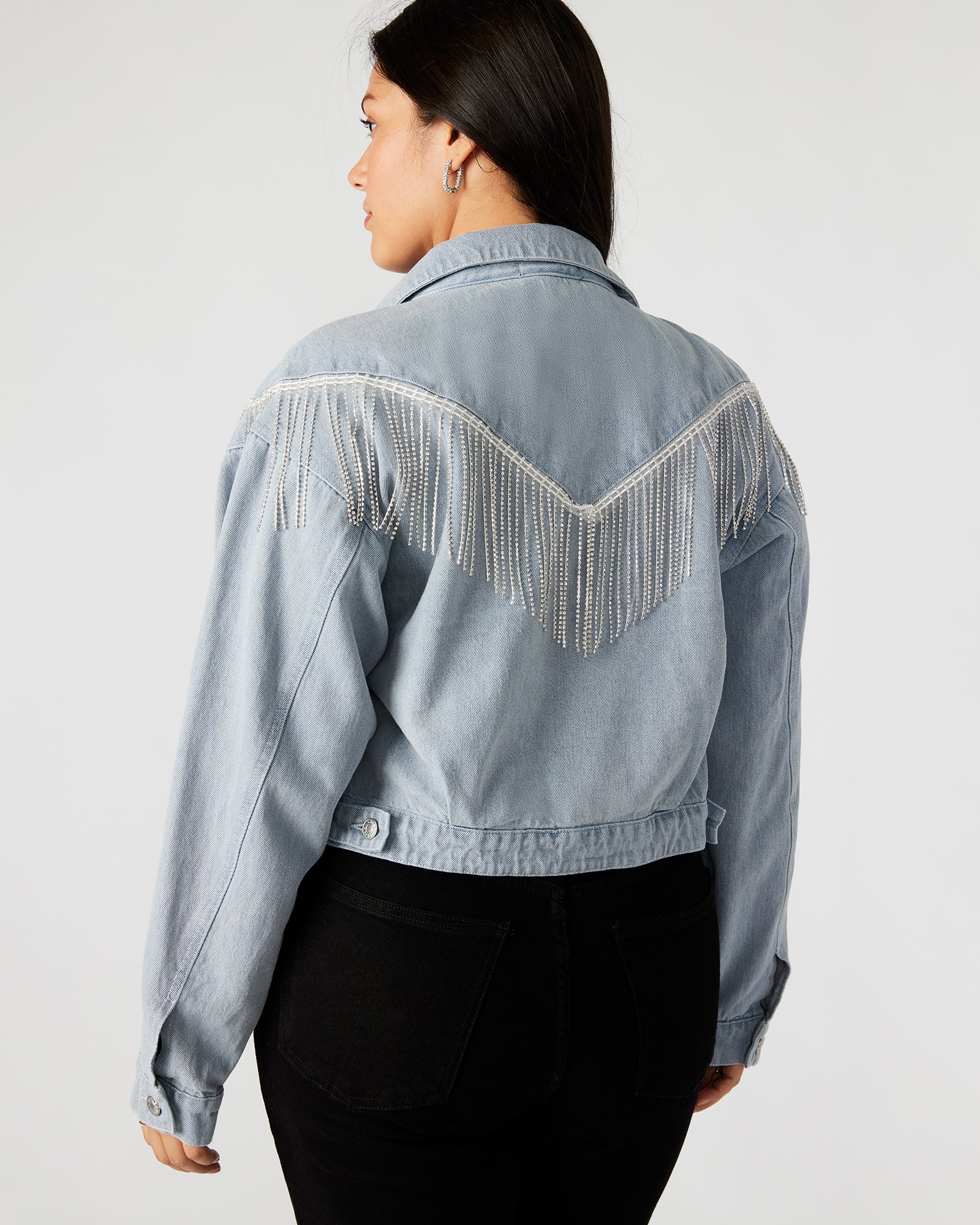 Model wearing the black cropped denim jacket, highlighting its fit and style.