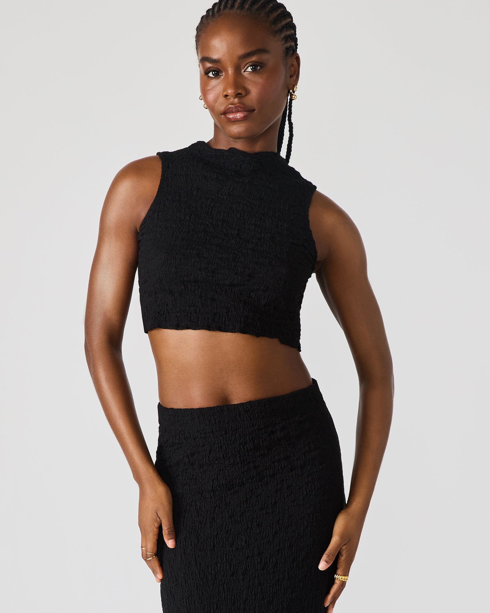 Close-up of the textured fabric and stitching of the matching skirt set.