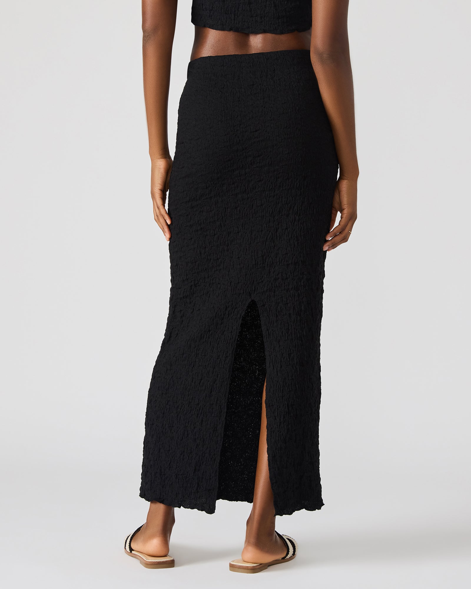 Back view of the two-piece set showing the flowy silhouette.