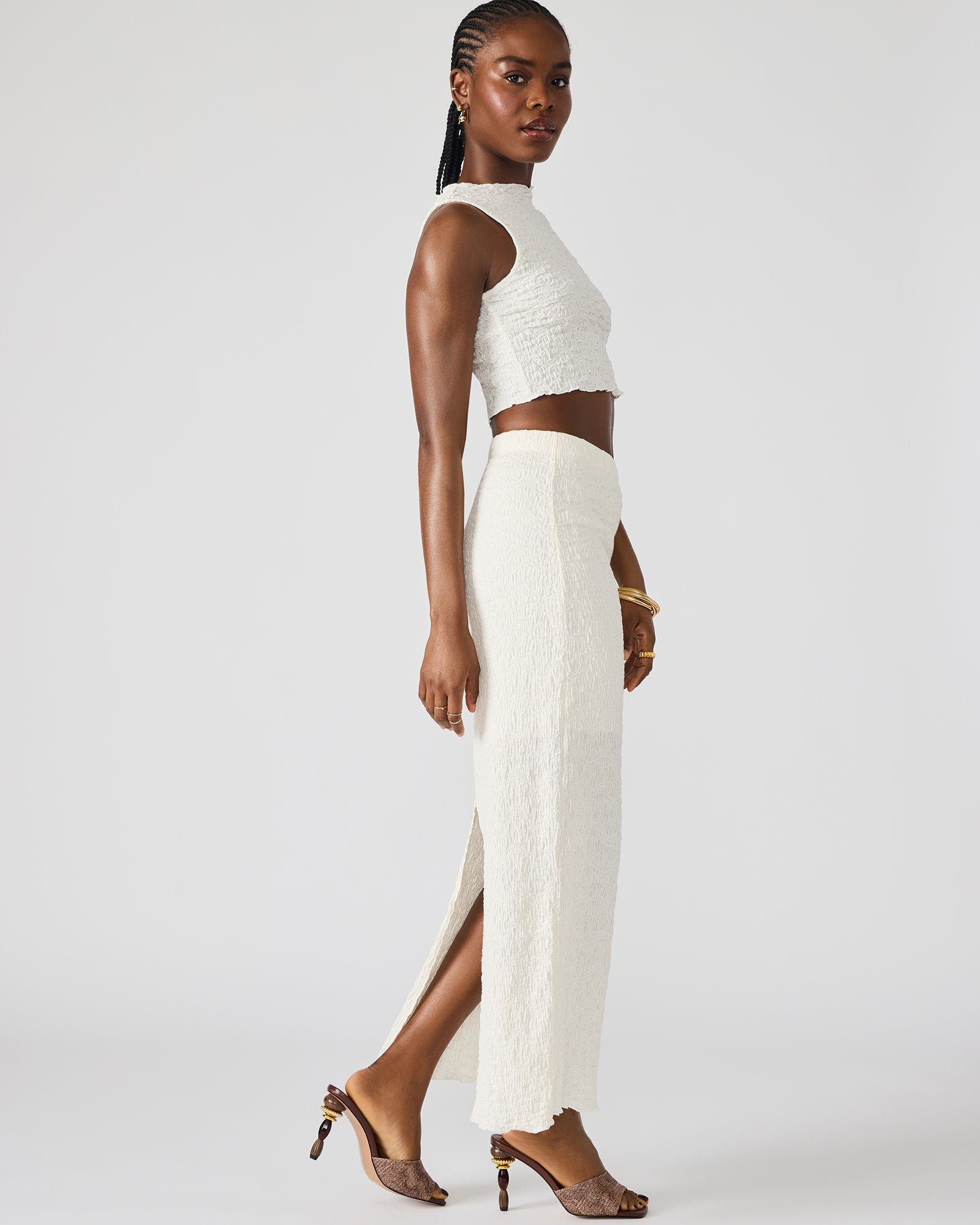 Close-up of textured fabric and funnel neckline of the cream set – ideal for casual summer outings.