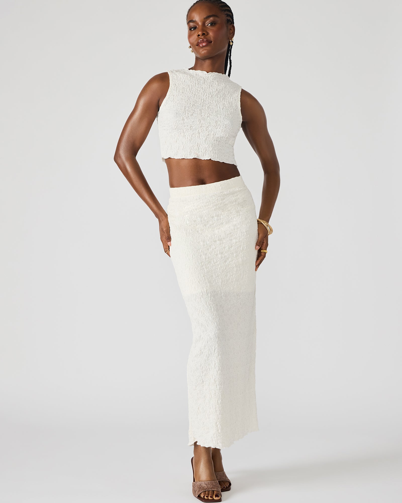 Front view of cream two-piece set with fitted maxi skirt and cropped top, styled for summer outfits.
