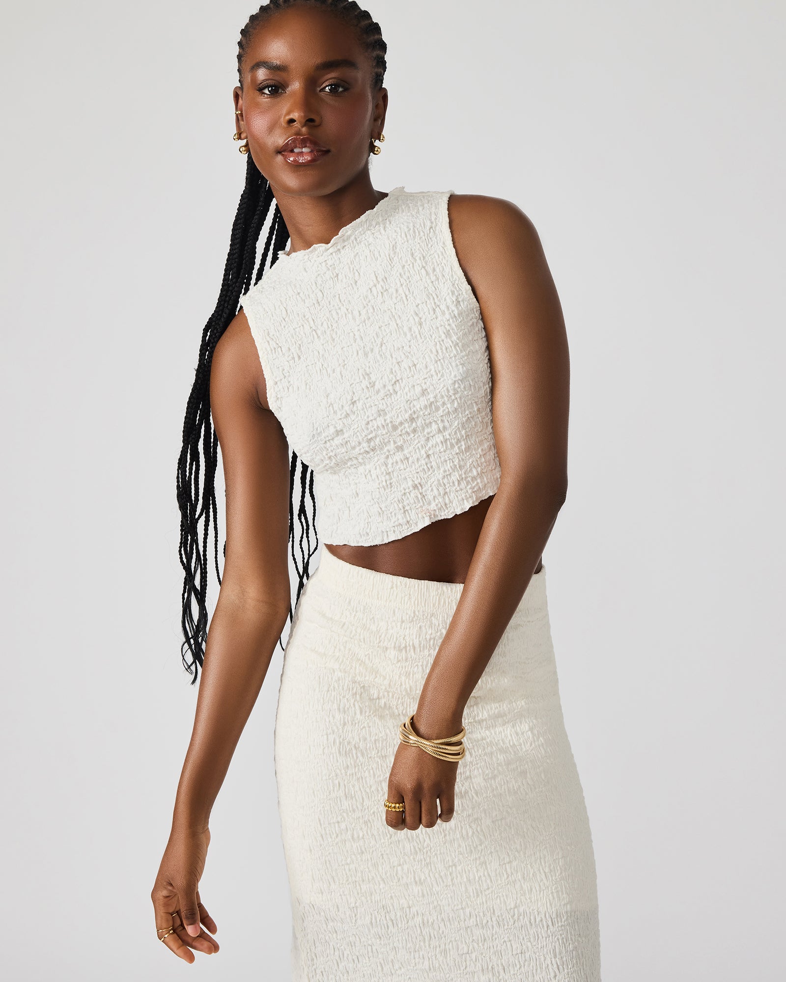Close-up of textured fabric and funnel neckline of the cream set – ideal for casual summer outings.