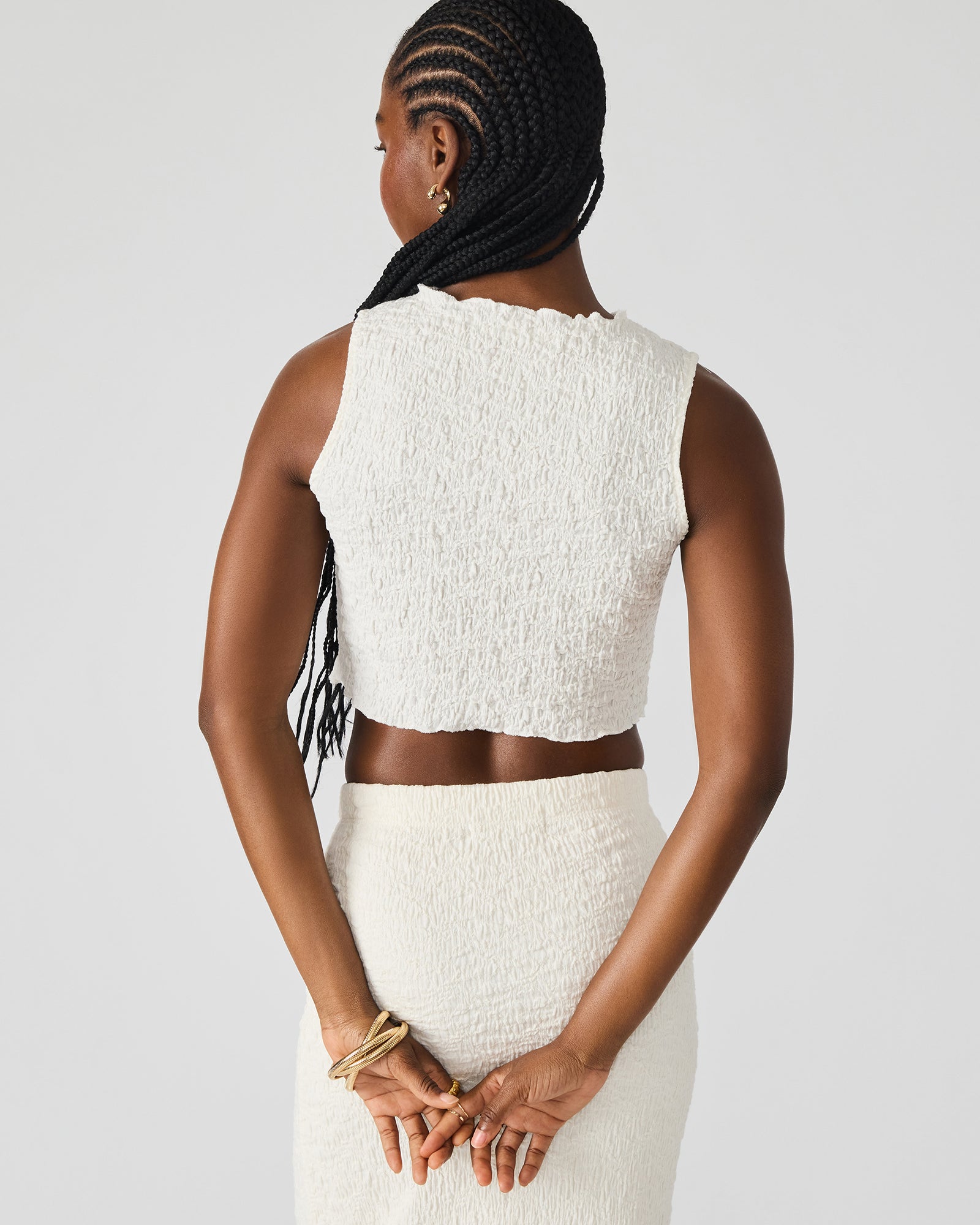 Front view of cream two-piece set with fitted maxi skirt and cropped top, styled for summer outfits.