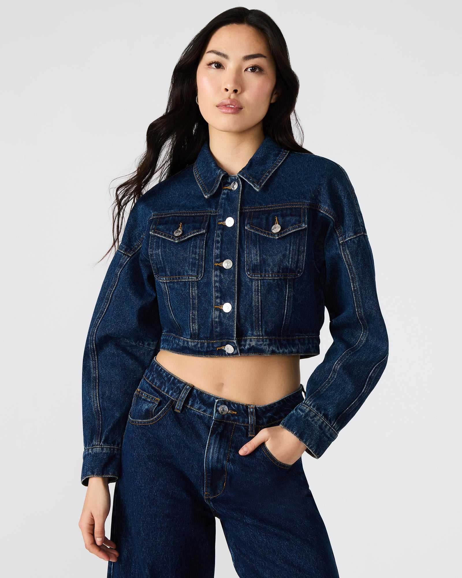 Close-up of textured denim fabric and stitching details