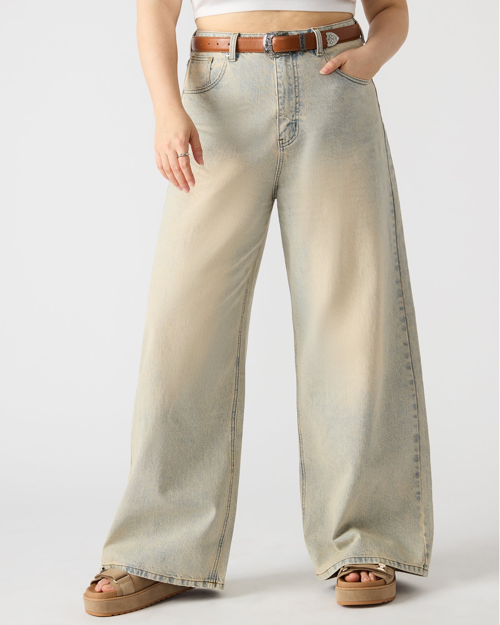 Side view of Magnus jeans highlighting the wide-leg design.