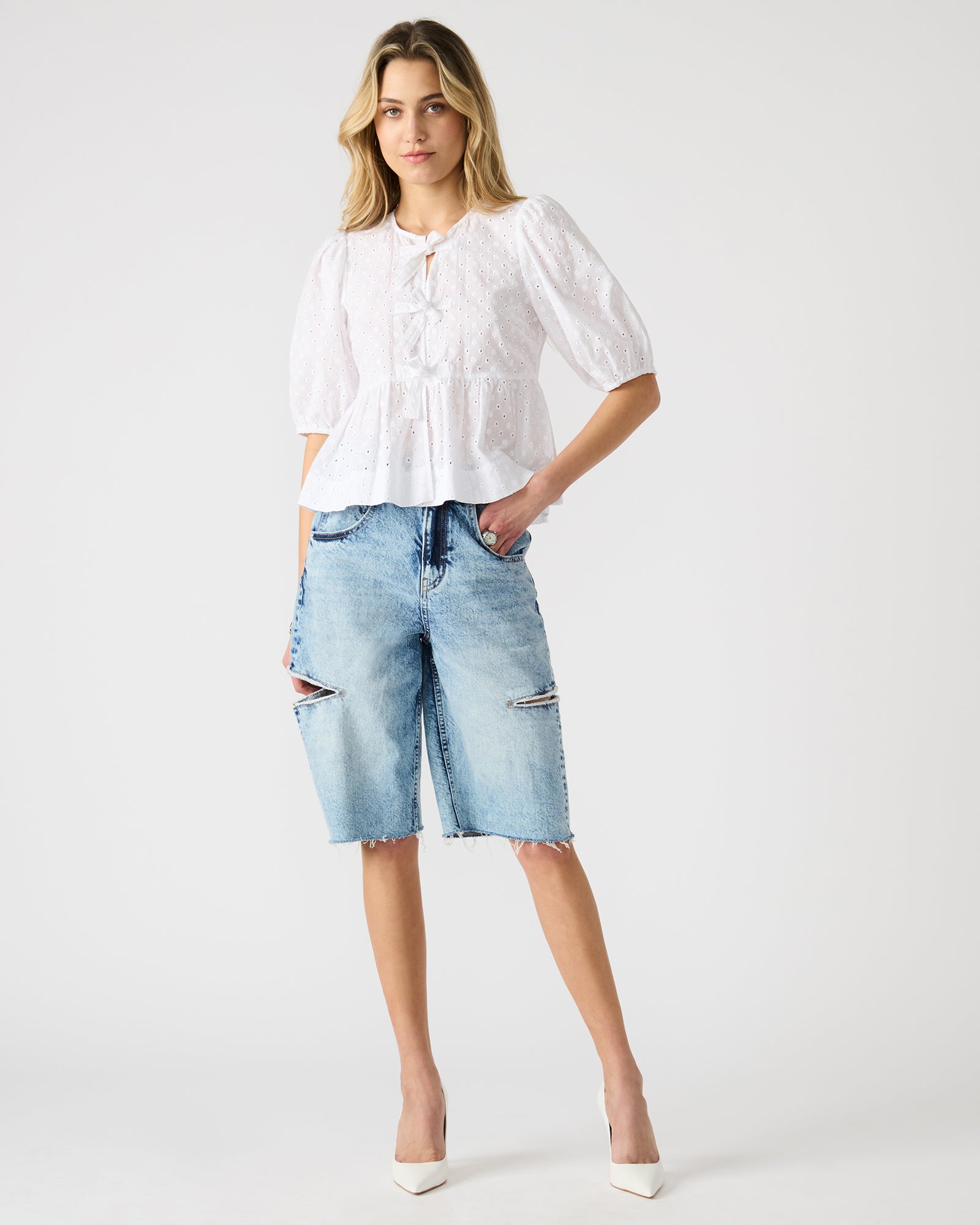 LANGE denim shorts for women displayed on a model, showcasing side slits.