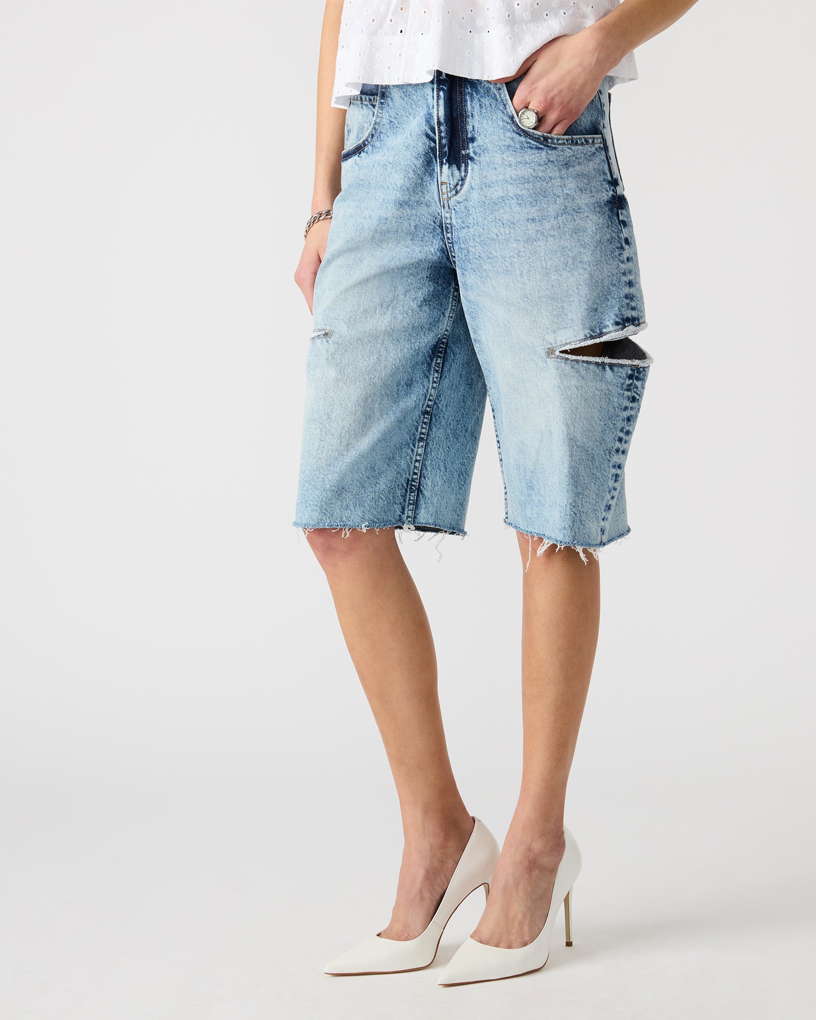 LANGE denim shorts styled with a casual top for a summer look.