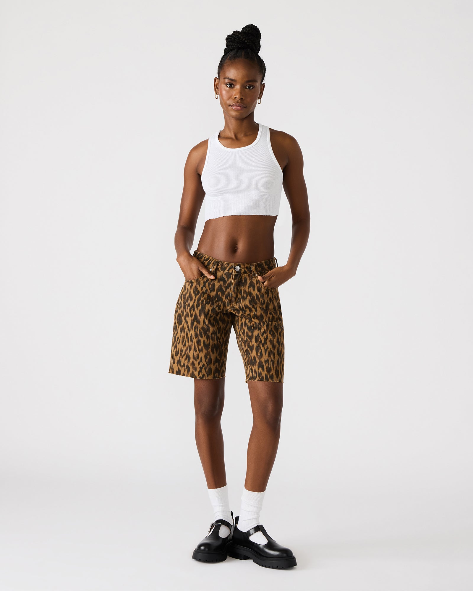 Front view of MILLIE leopard print denim shorts on a model, ideal for summer wear.