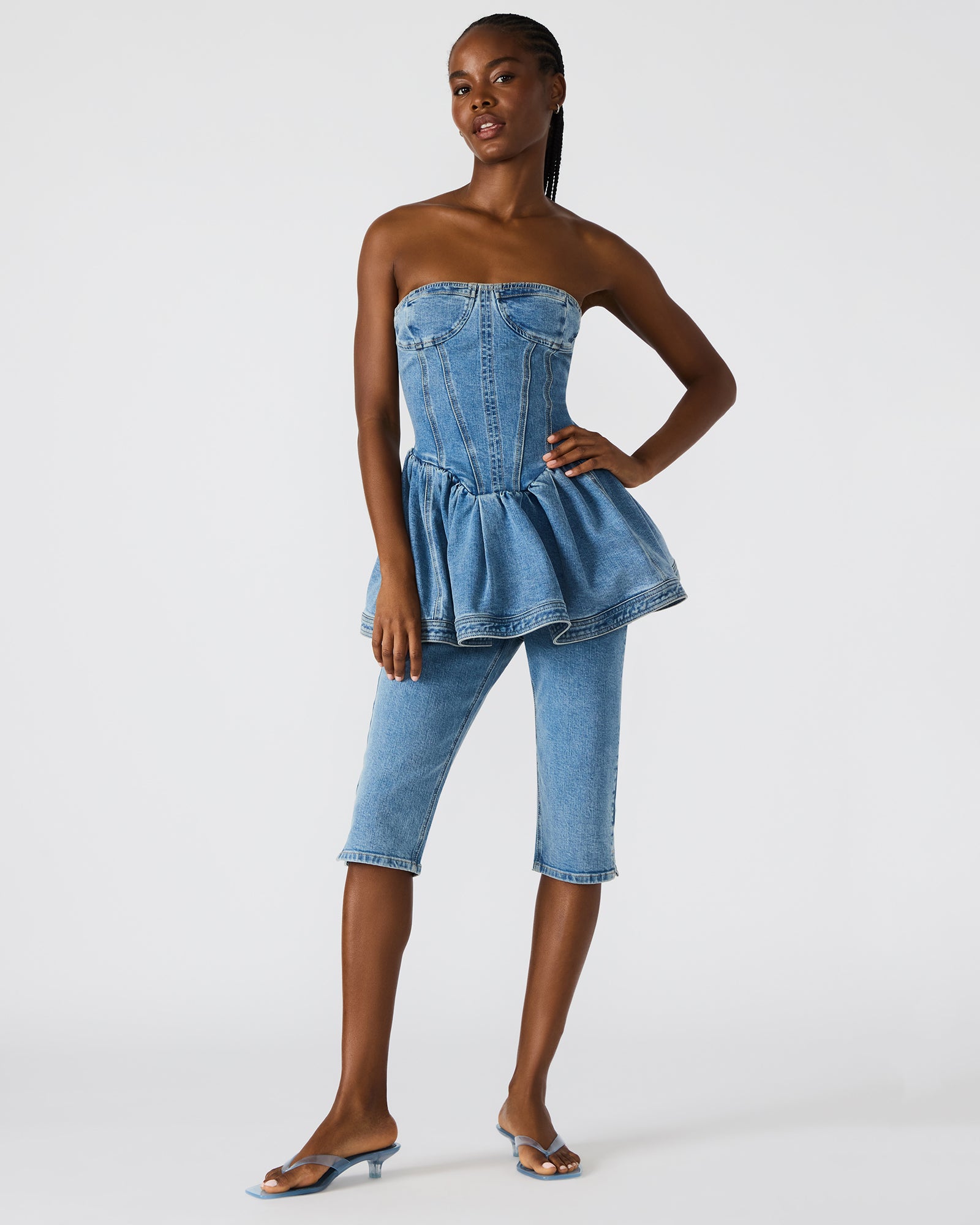 Rina Skinny Fit Denim Capri Pants displayed on a model in a casual setting.