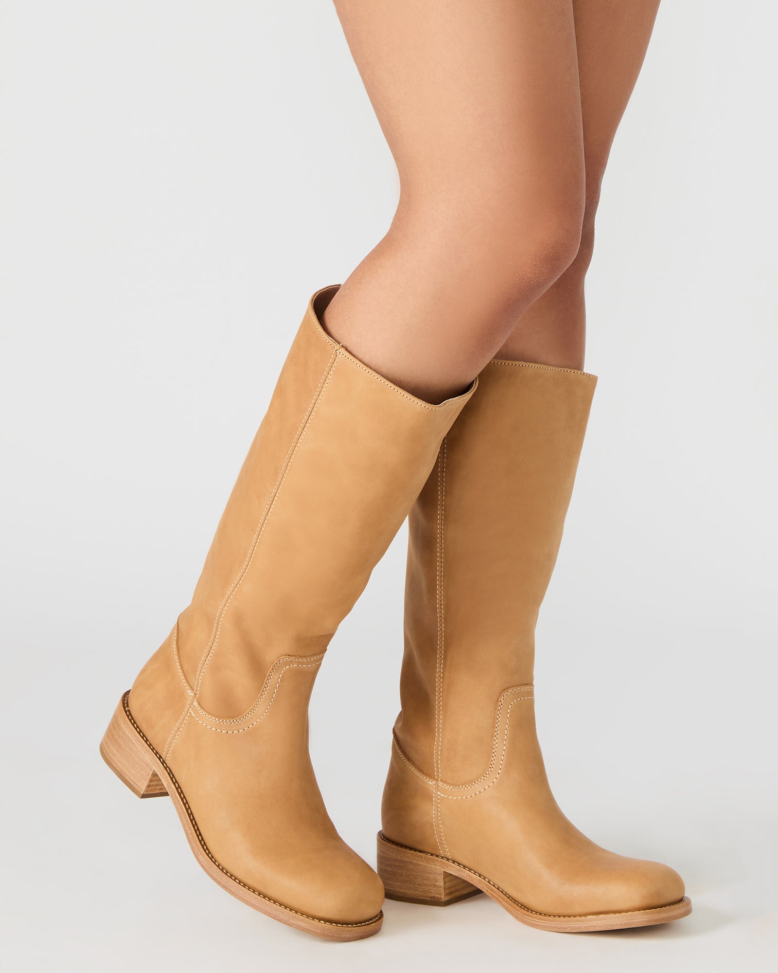 Close-up of the wide calf leather boots showing detailed stitching and leather texture