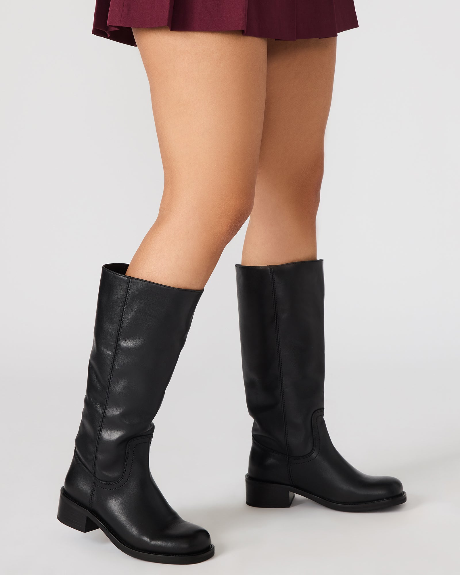 Front view of stylish knee-high fashion boots for women