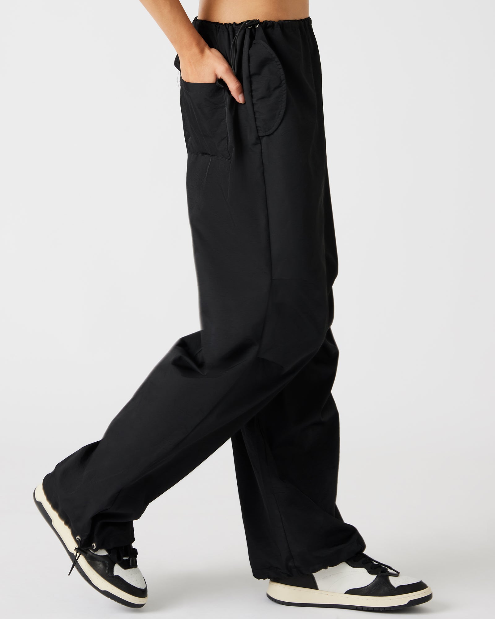 Front view of PIA wide leg parachute pants in black, perfect for casual outings.