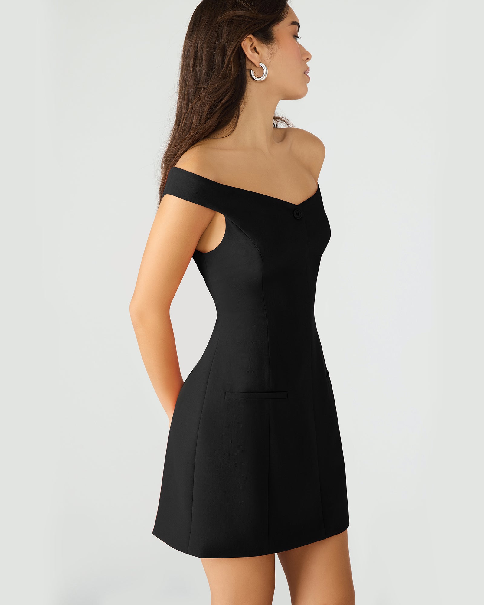 Back view of the off-the-shoulder dress with zipper closure.