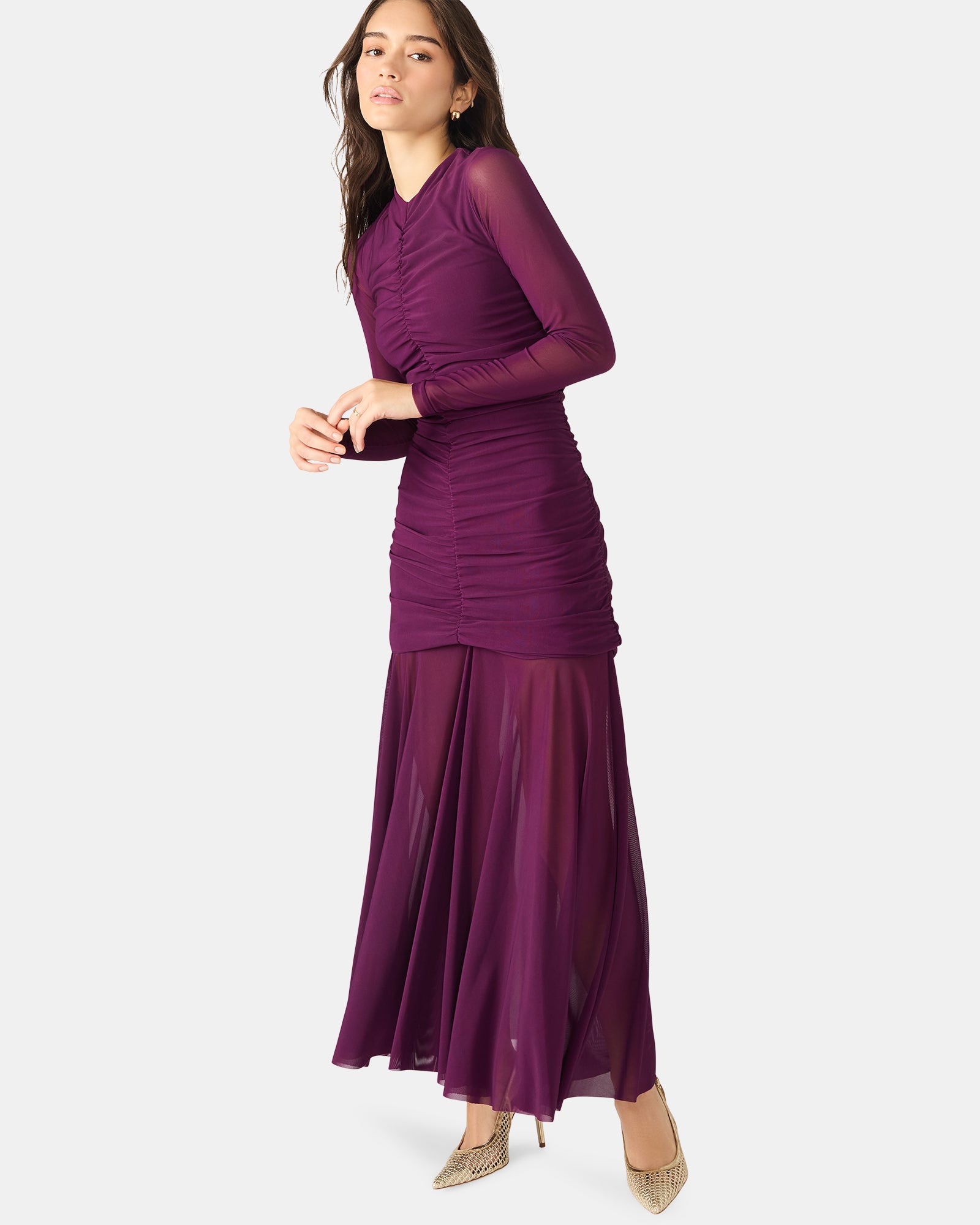 Side angle of the black long sleeve dress, highlighting the elegant silhouette.