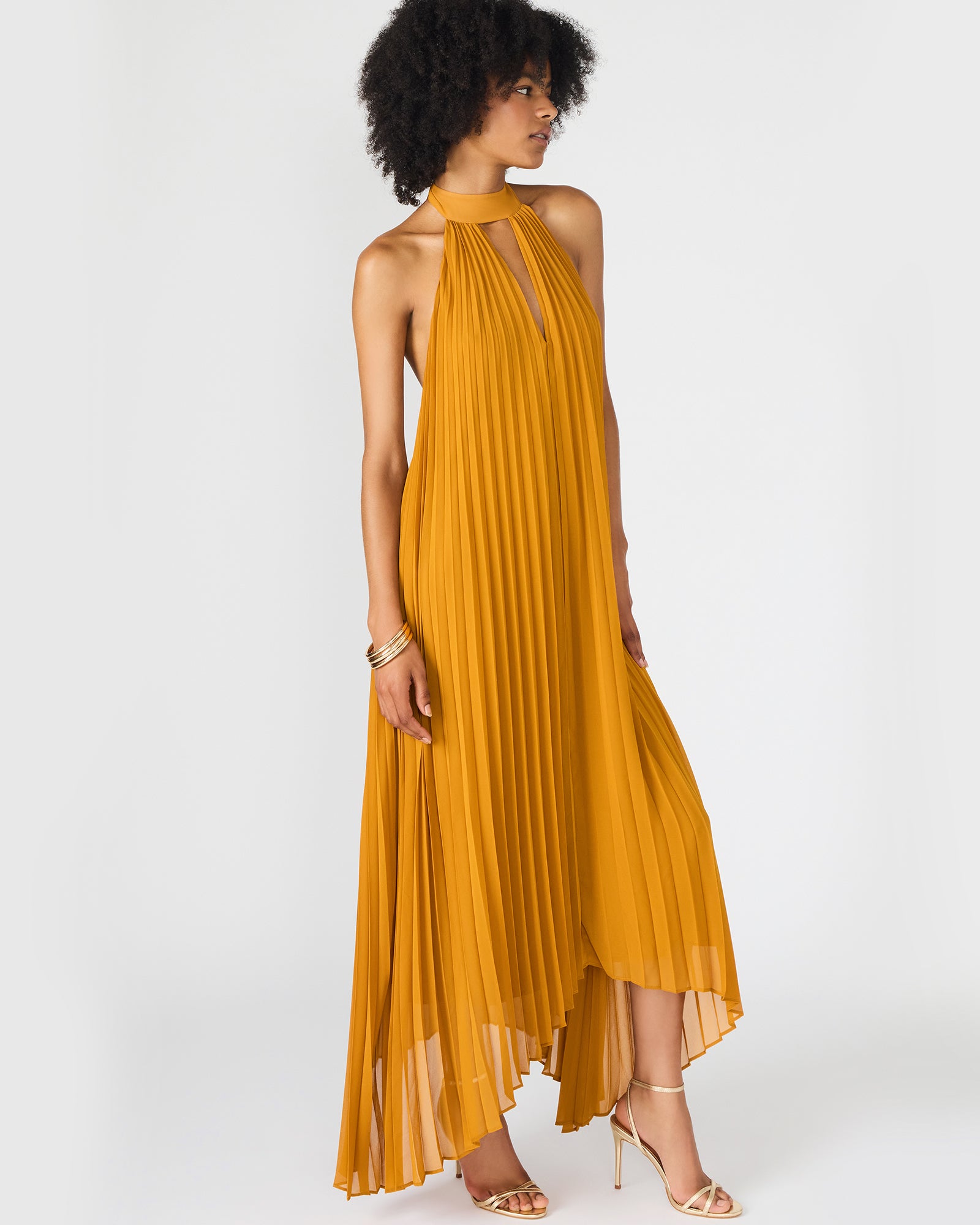 Front view of black maxi dress with elegant cutout detail on a neutral background