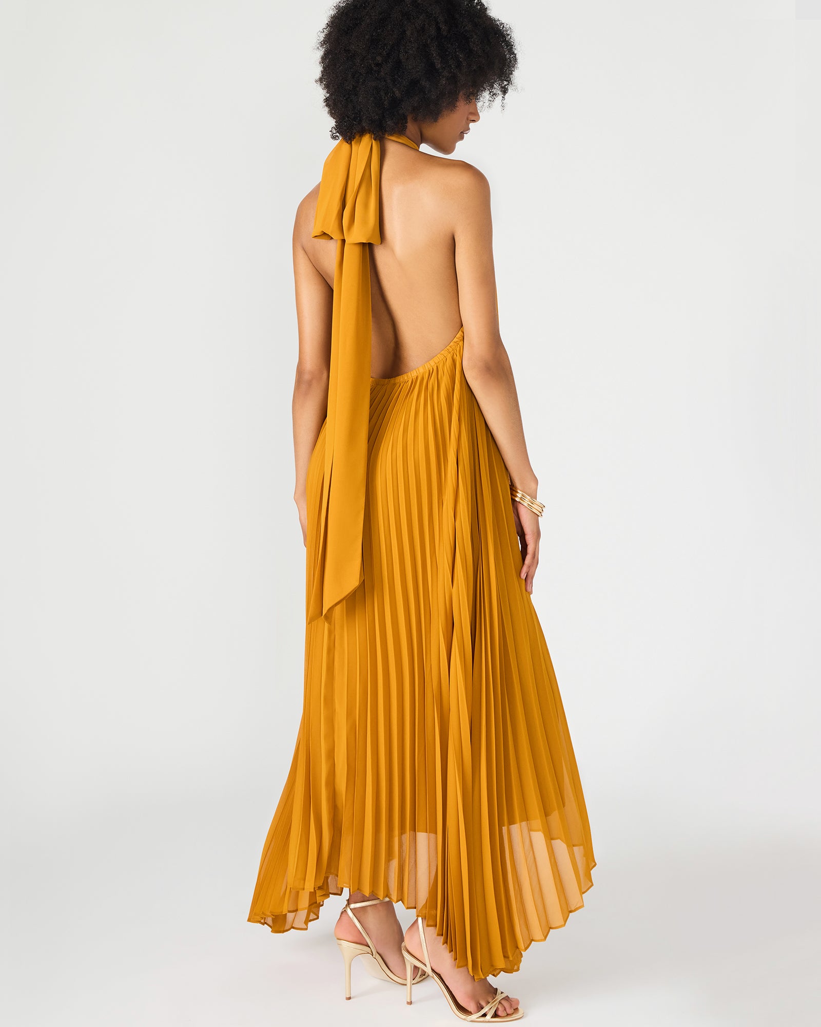 Close-up of white maxi dress fabric showing gentle draping and texture