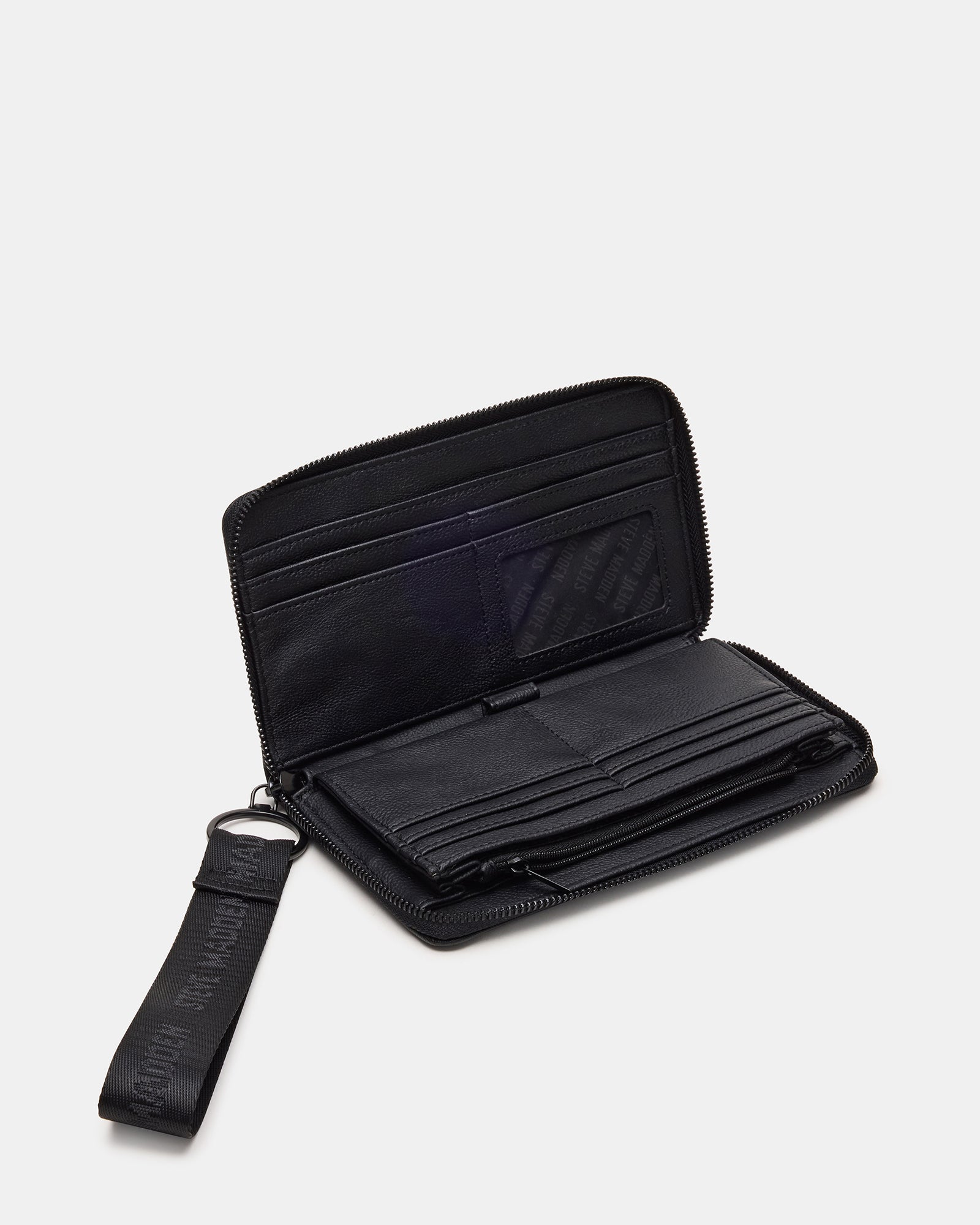 Close-up of Coach wristlet wallet showing zipper and card slots