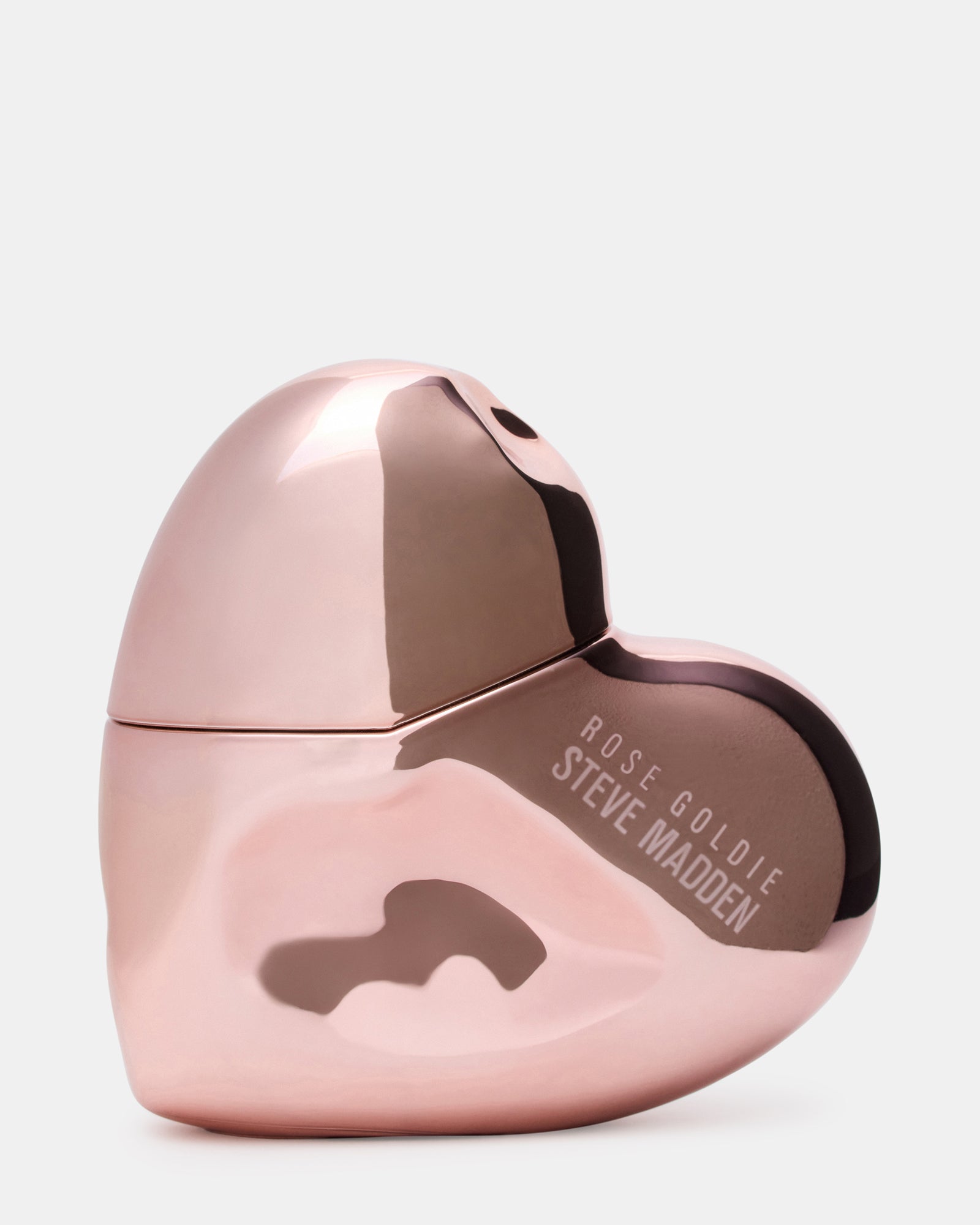 Bottle of rose gold perfume angled beside peonies, ideal for upscale vanity displays.