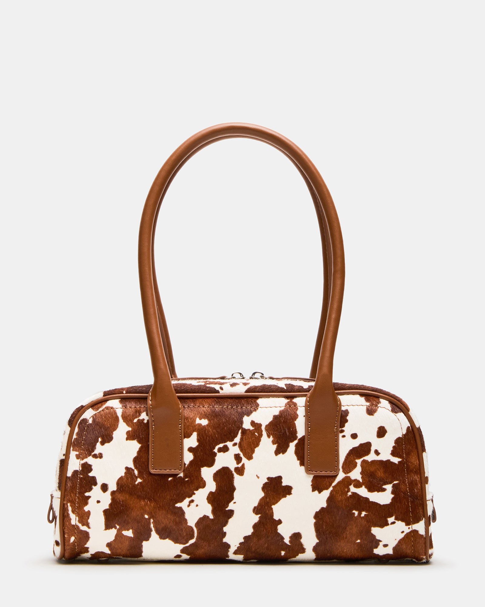 Front view of Anise cow print shoulder bag with exaggerated tubular straps