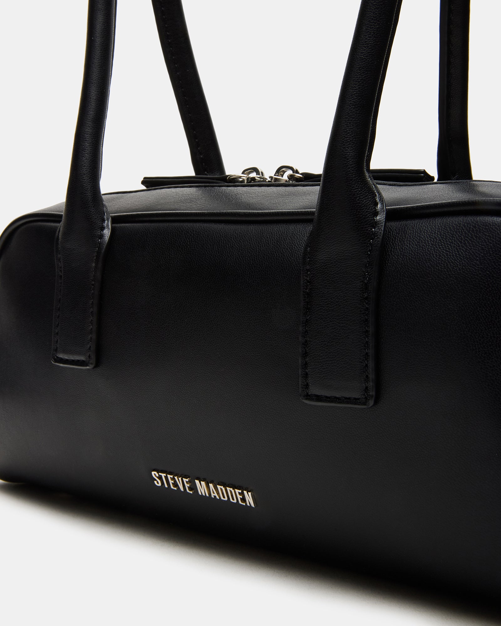 Side angle of the black purse showcasing its elegant design.