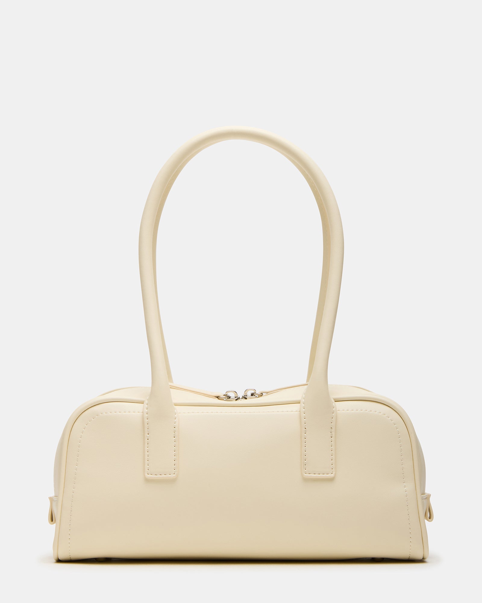 Chic minimalist shoulder bag displayed on a wooden surface, showcasing its sleek design.