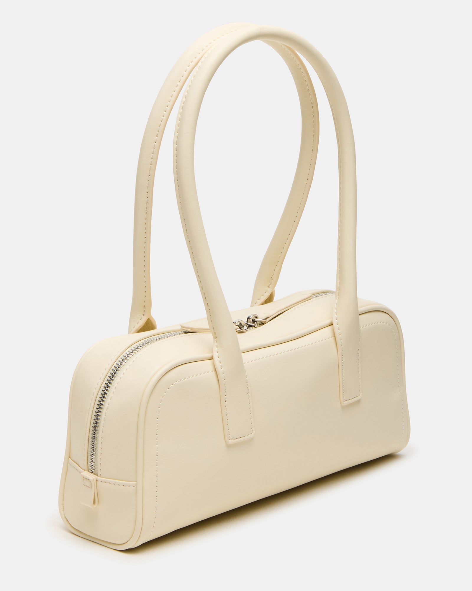 Chic minimalist shoulder bag displayed on a wooden surface, showcasing its sleek design.
