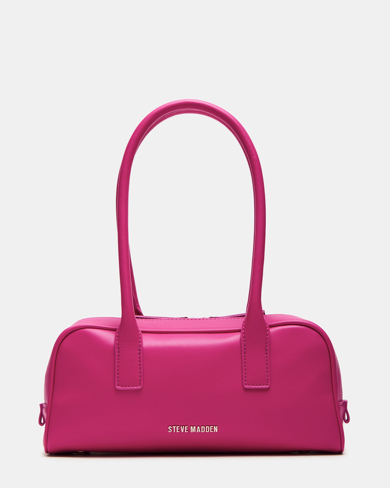 Model showcasing the fuchsia coach shoulder bag in an urban setting