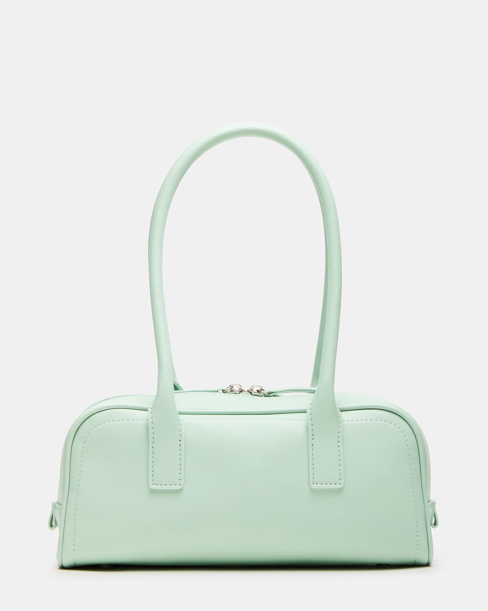 Pistachio minimalist shoulder bag displayed against a stylish backdrop.