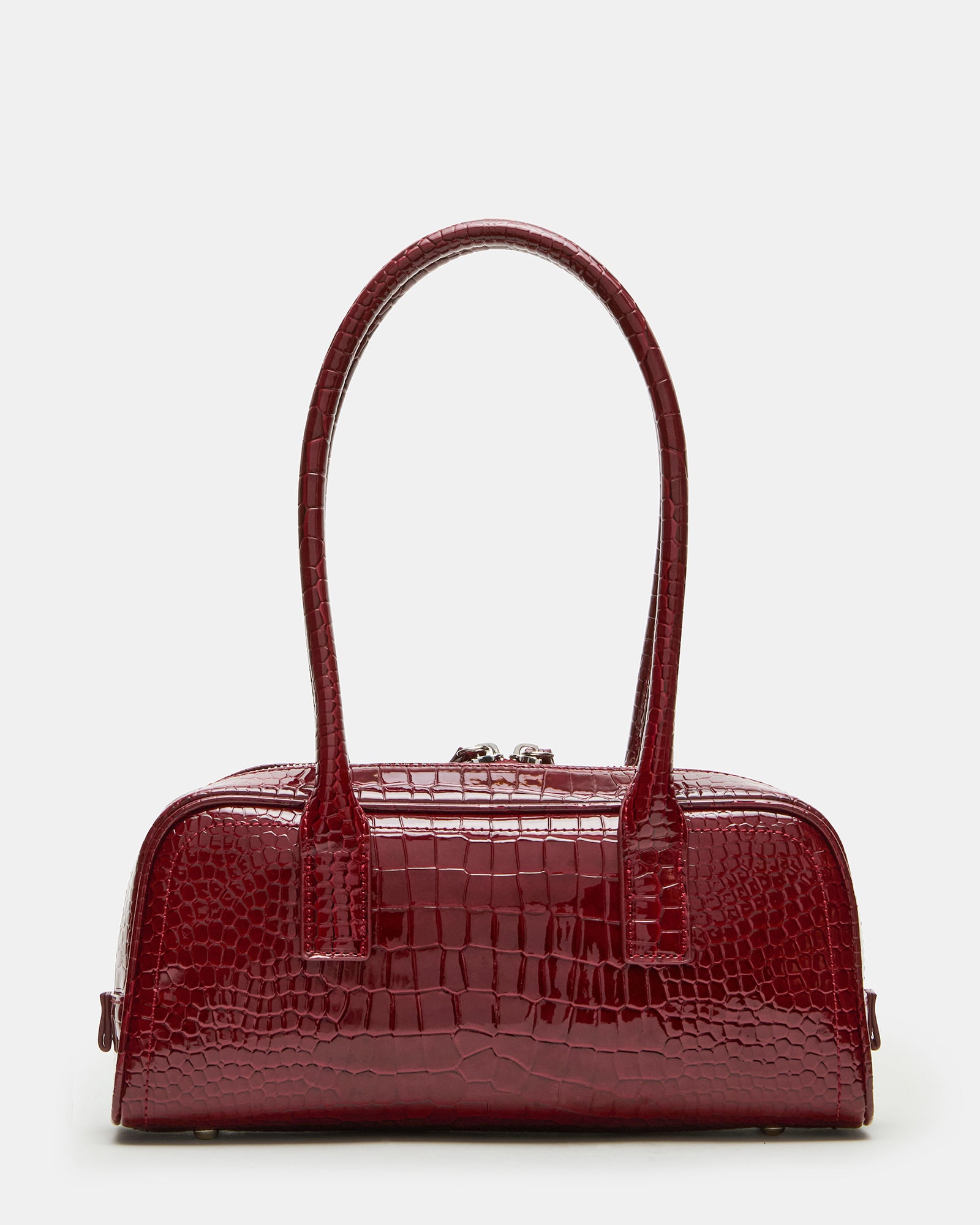 Front view of red croc bag with tubular shoulder straps on a marble surface
