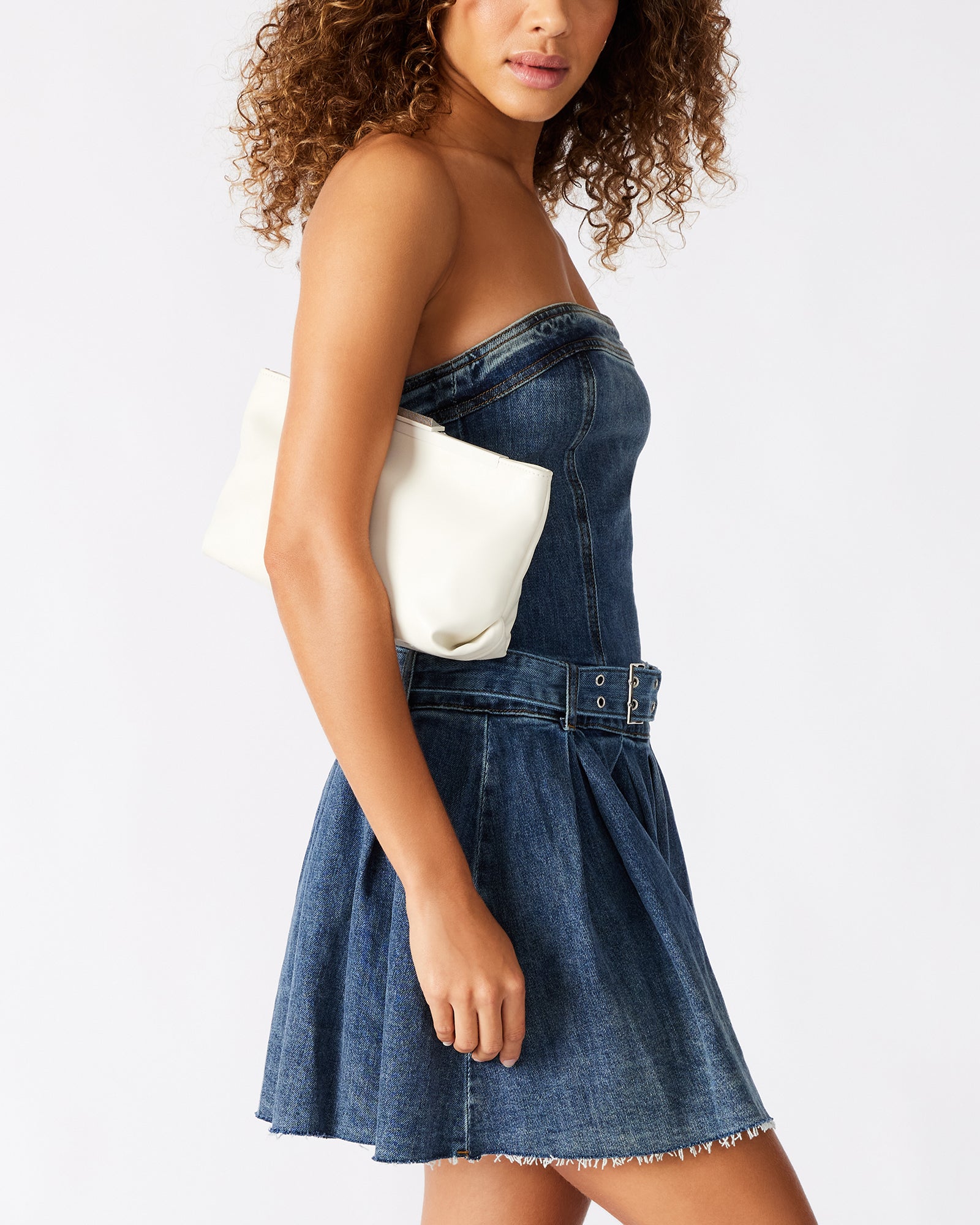 Side angle of the Antoni clutch bag showing pyramid frame and smooth off-white finish