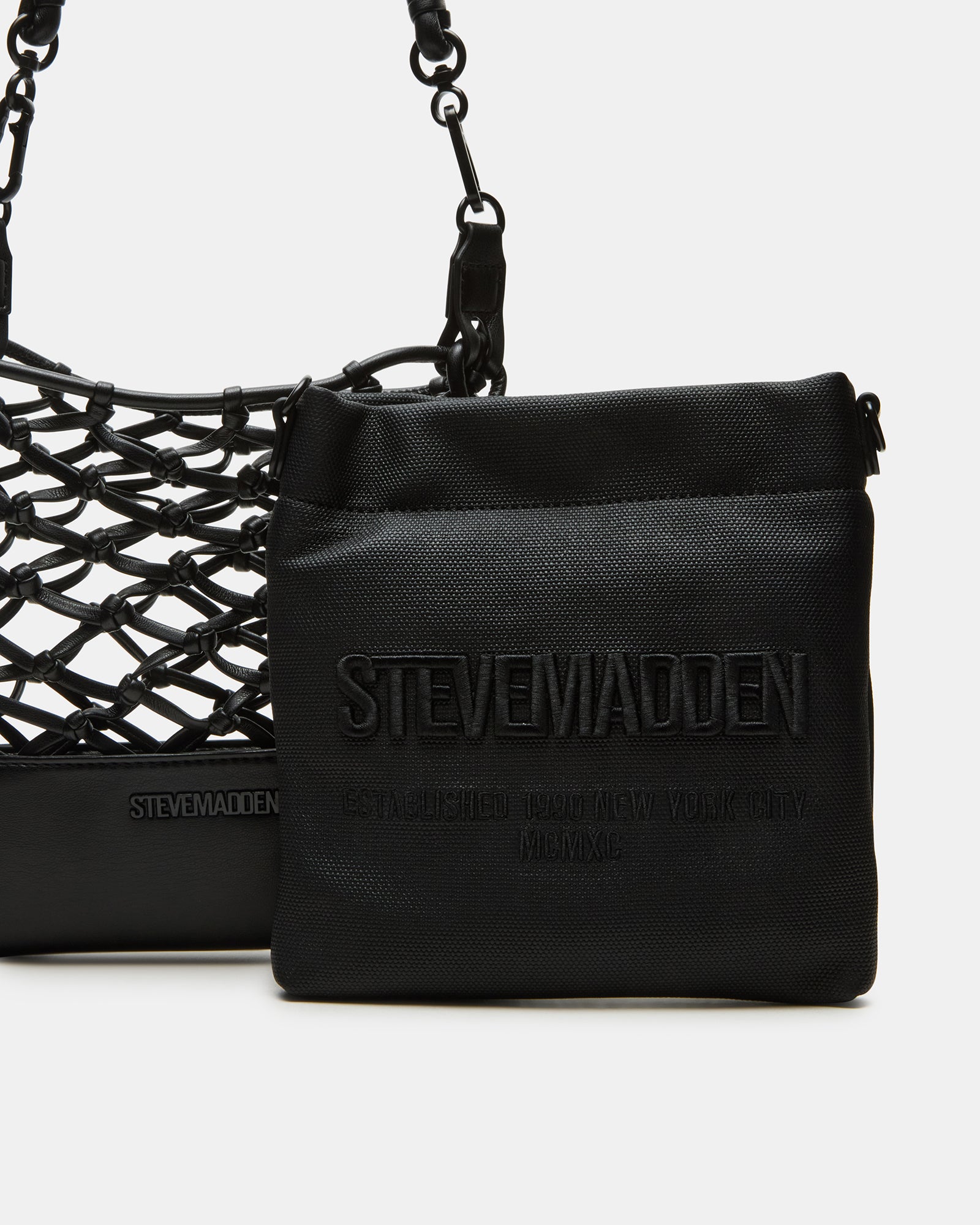 Front view of crossbody bag showing net-caged design and pouch compartment