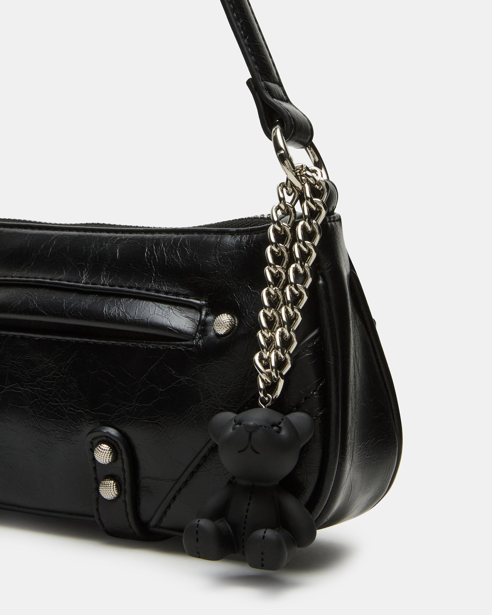 BECKA bag worn crossbody style on a model walking through Manhattan streets