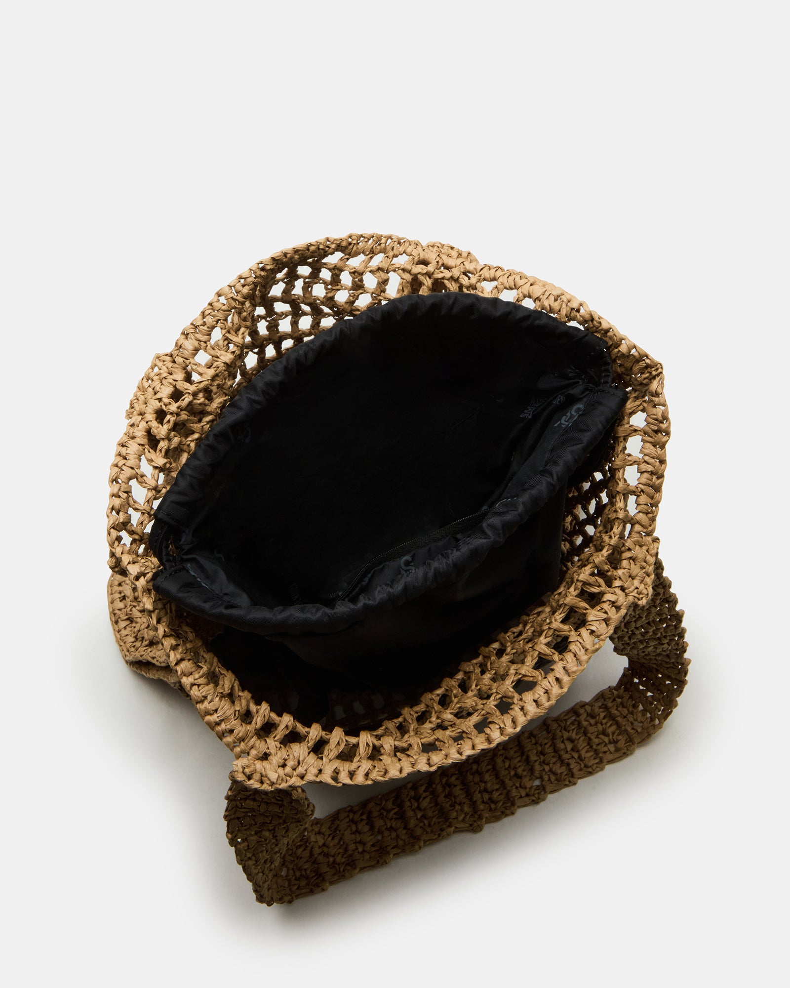 Side angle of the woven leather tote handbag with drawstring pouch inside.