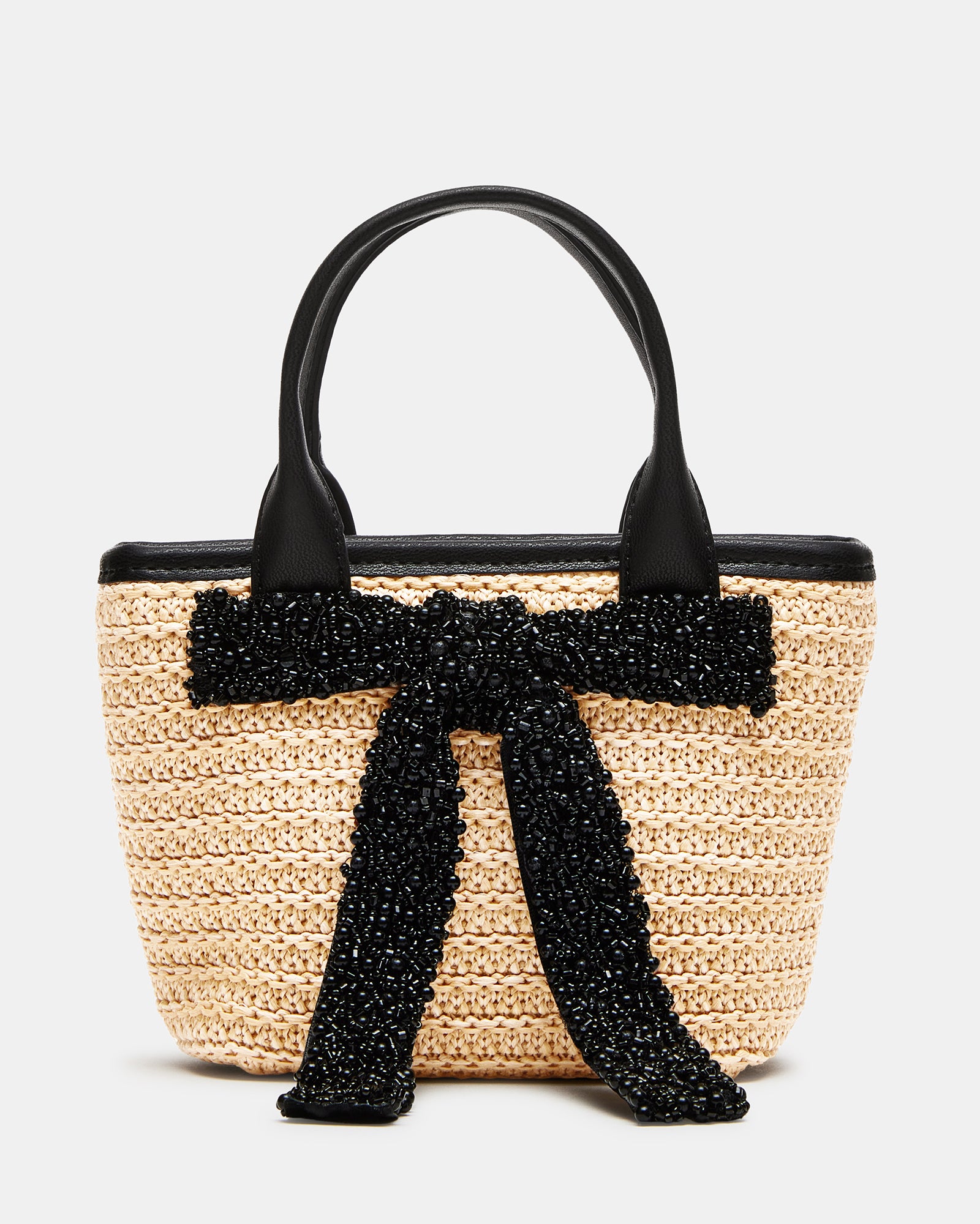 Front angle showing the beaded bow and top-handle strap against NYC street style backdrop