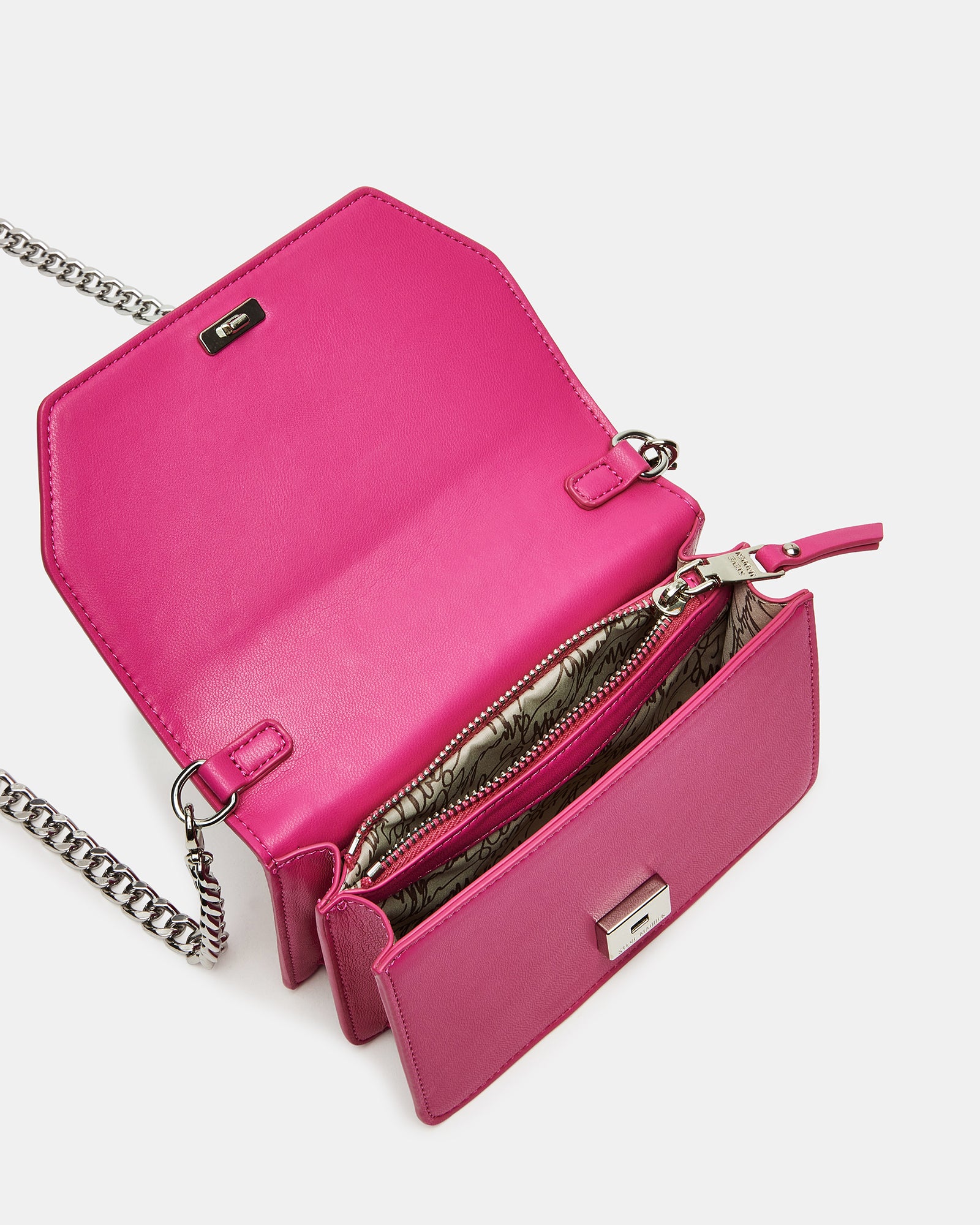 Side angle of the pink mini bag featuring a star charm