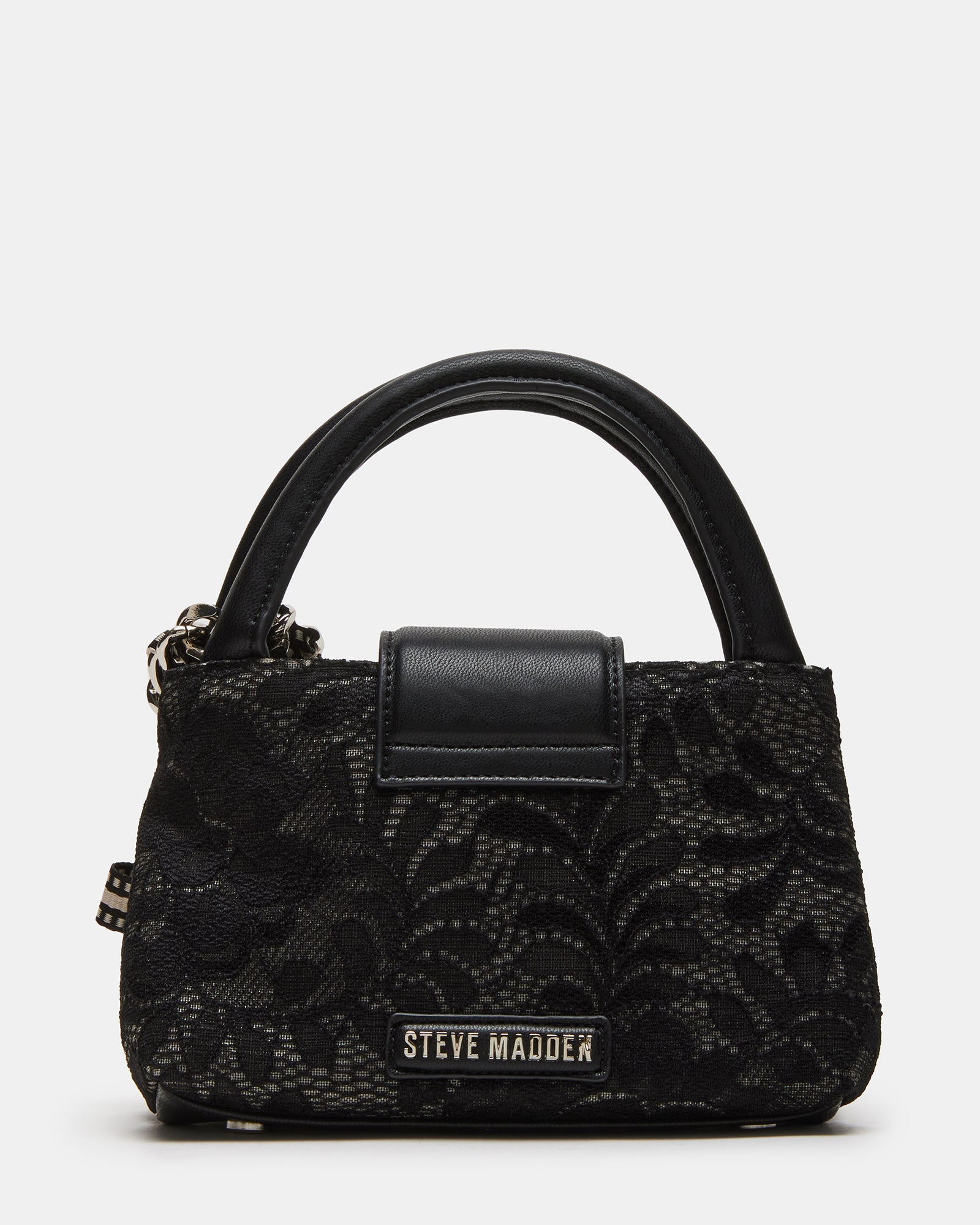 Model wearing a black lace crossbody bag, showcasing its hands-free convenience.