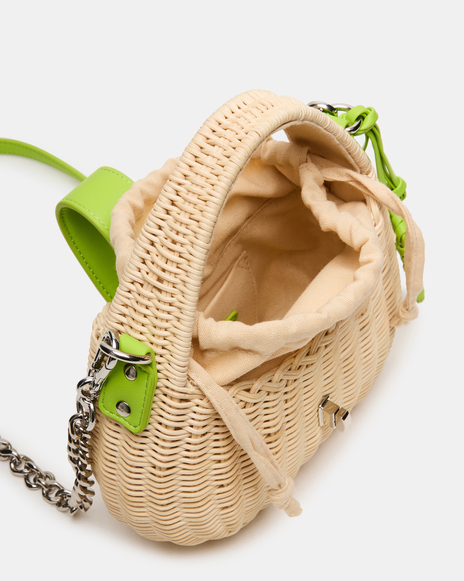 Interior view of the mini bag showing drawstring pouch inside