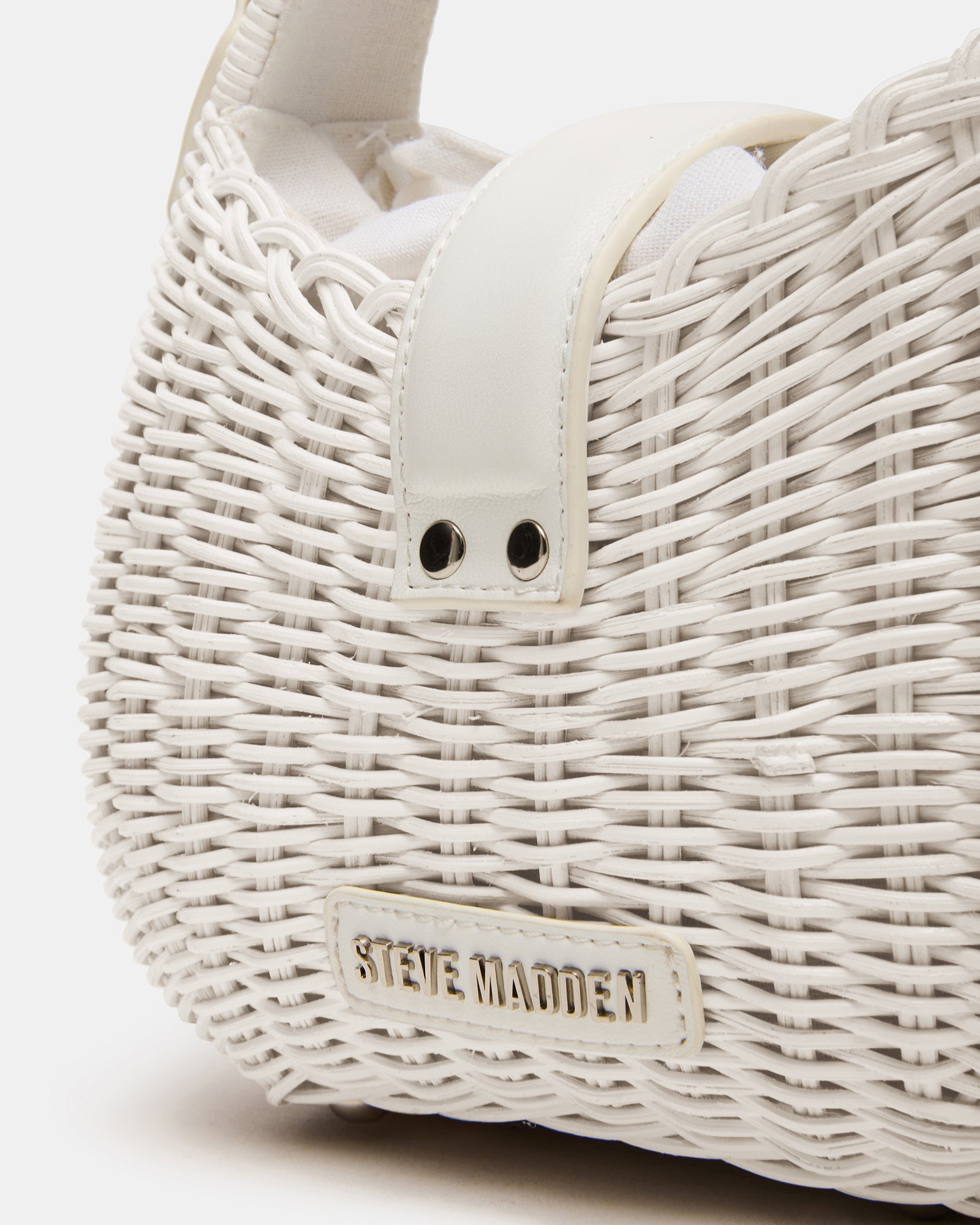 Canela mini bag displayed with duster bag for protection and style