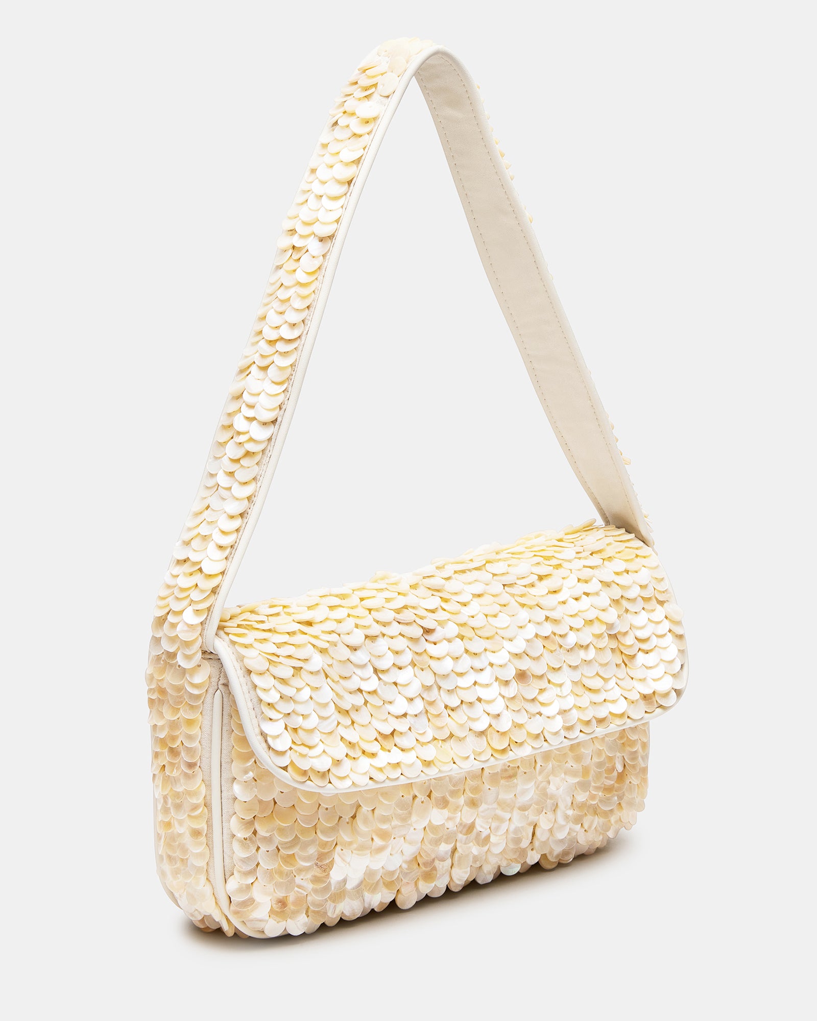 Close-up of the ivory beaded bag with shell disc embellishments showing the detailed beading