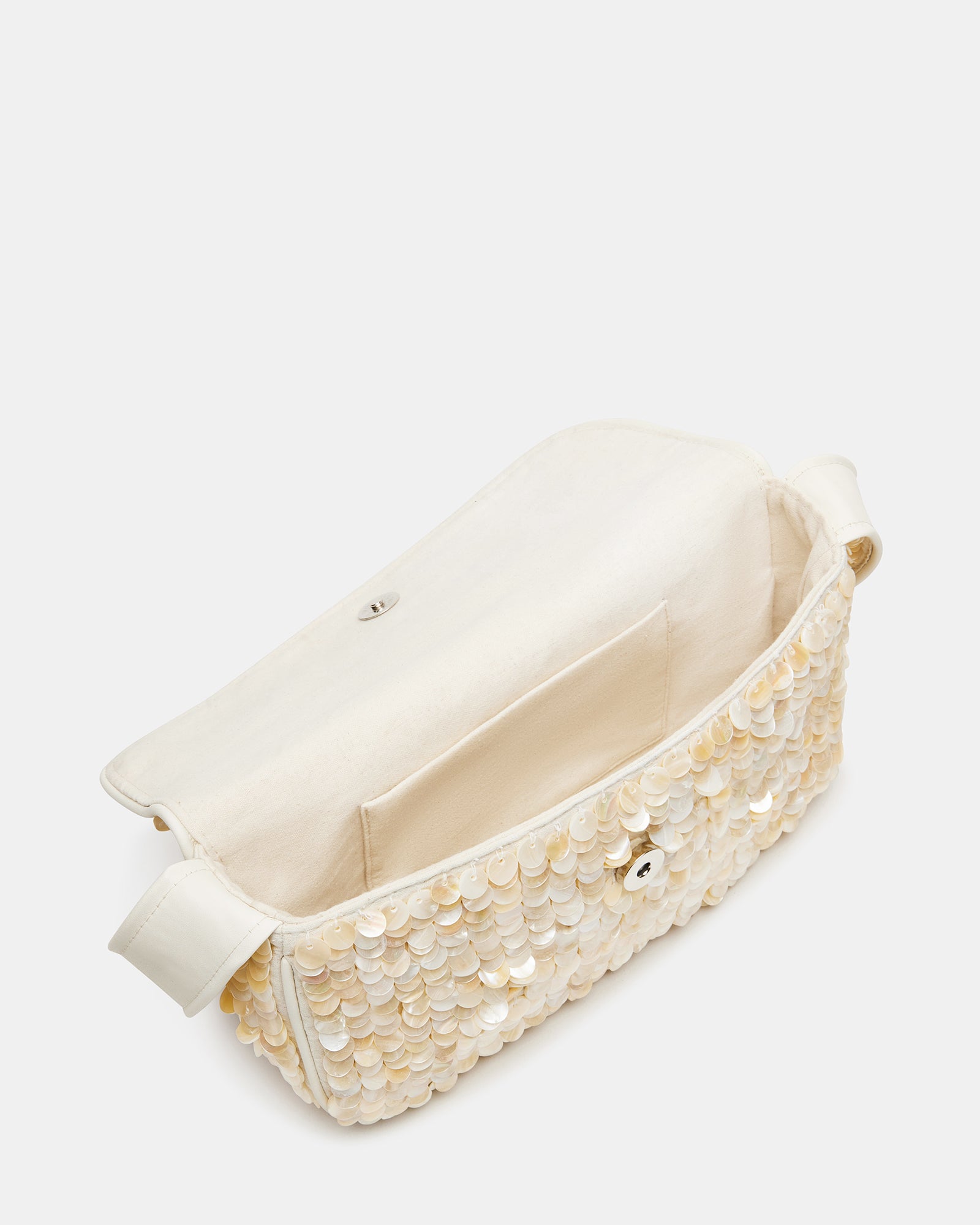 The Charli bag with its front flap and mag snap closure, styled for a night out