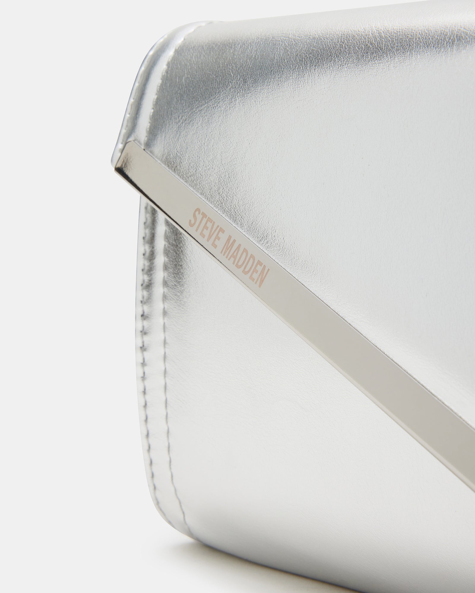Interior view demonstrating the six card slots of the silver metallic clutch bag.