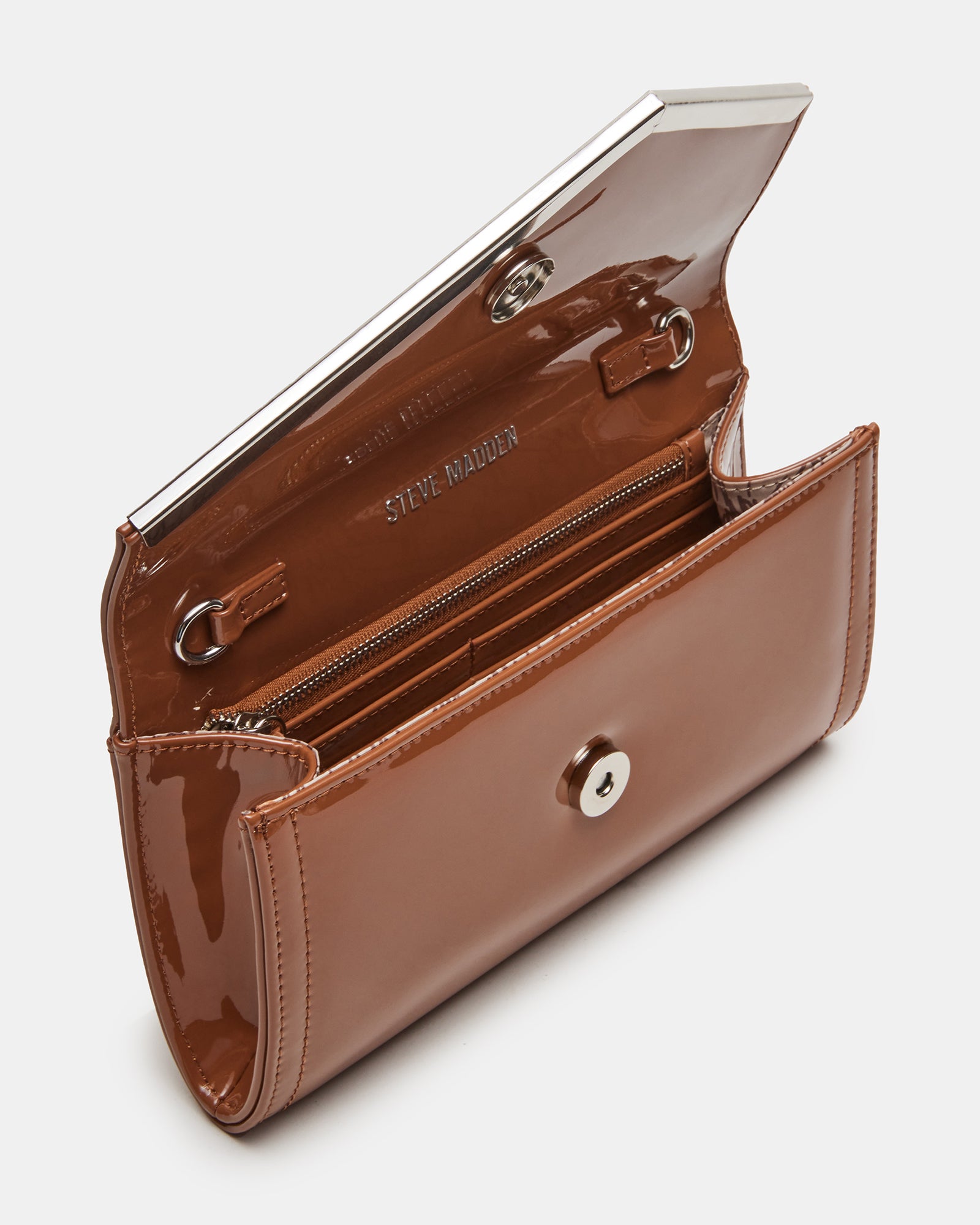 Evening clutch bag worn crossbody with chain strap at a cocktail party