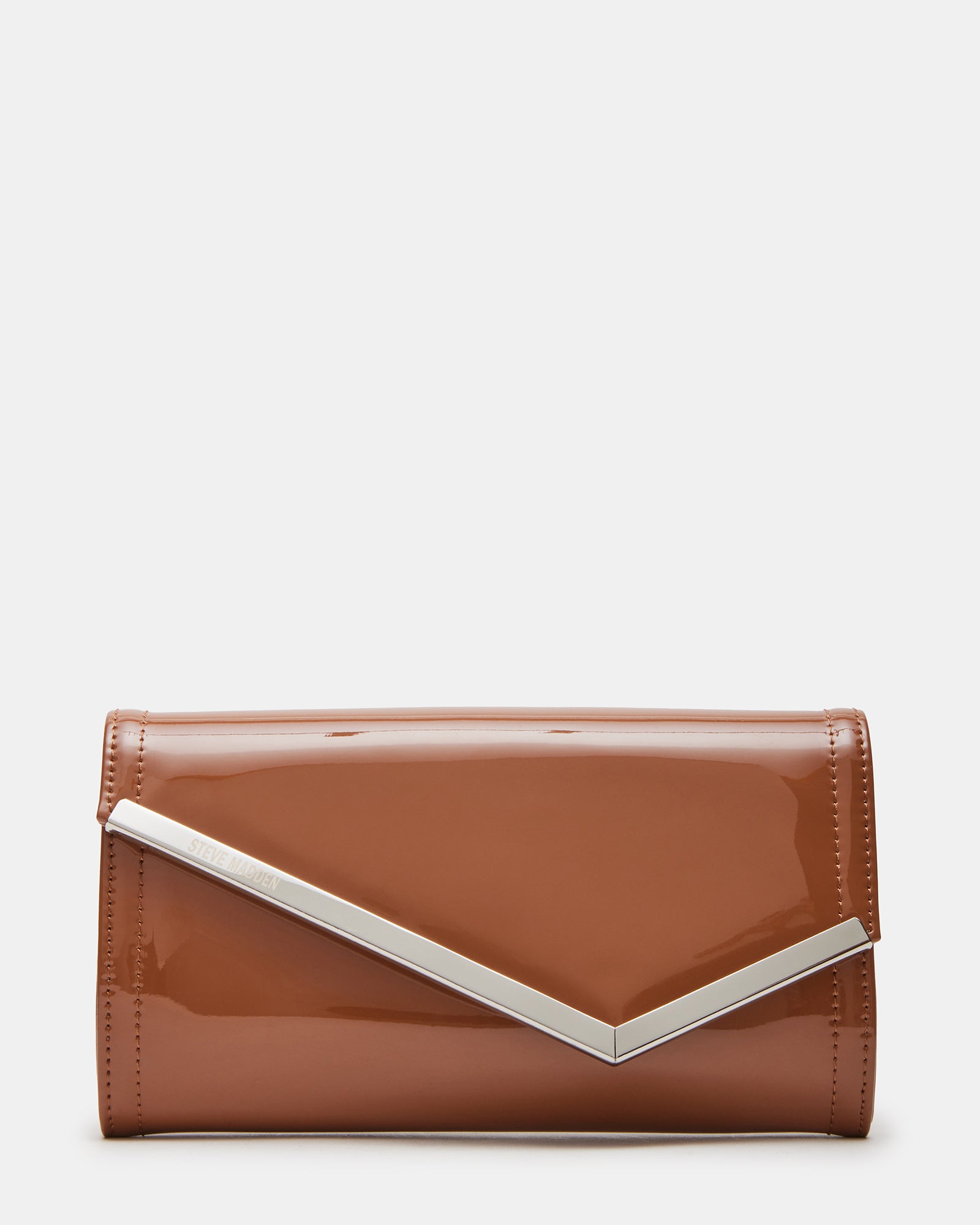 Close-up of tan patent leather clutch bag showing asymmetrical flap detail