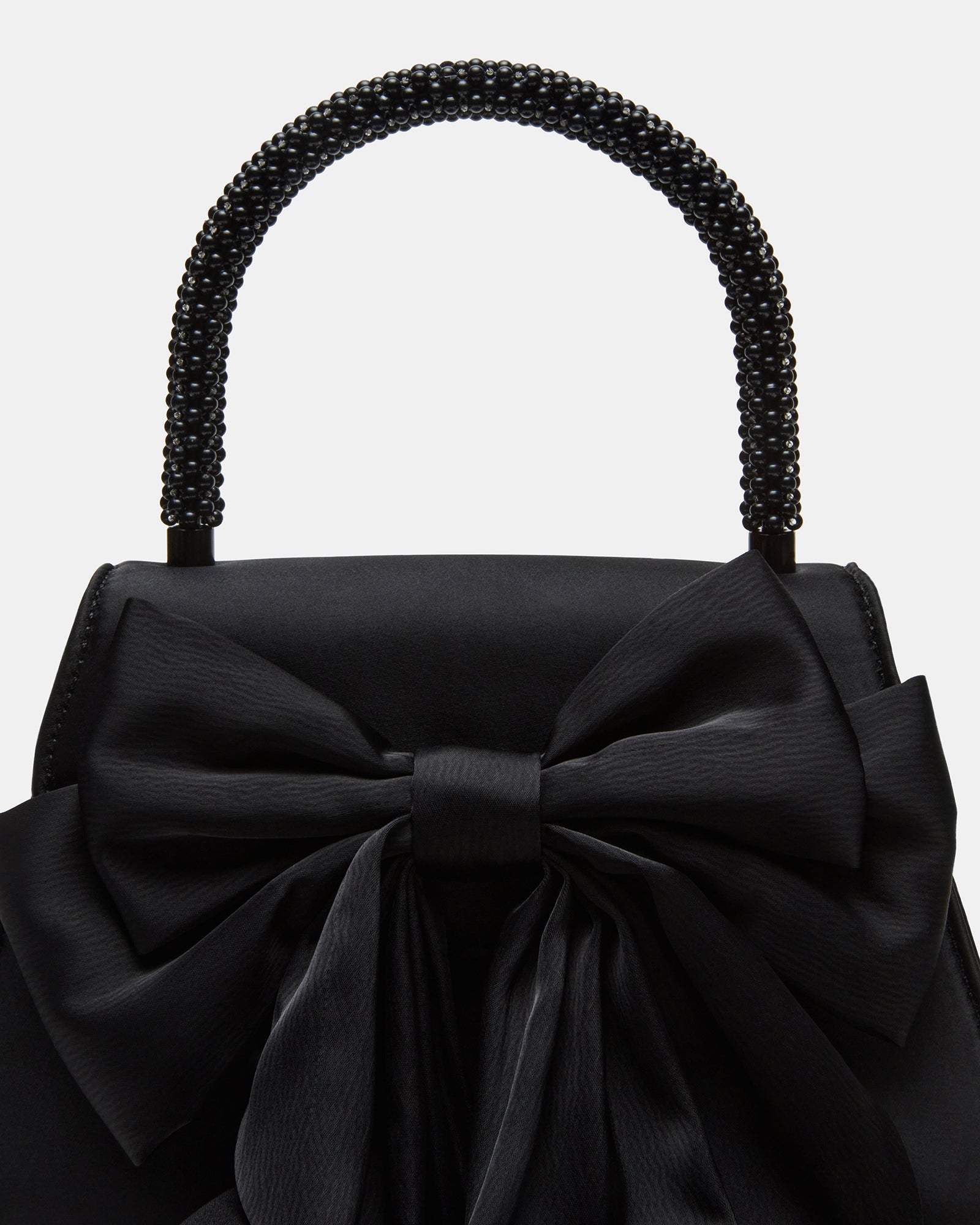 Evening bag worn crossbody with a chic evening dress