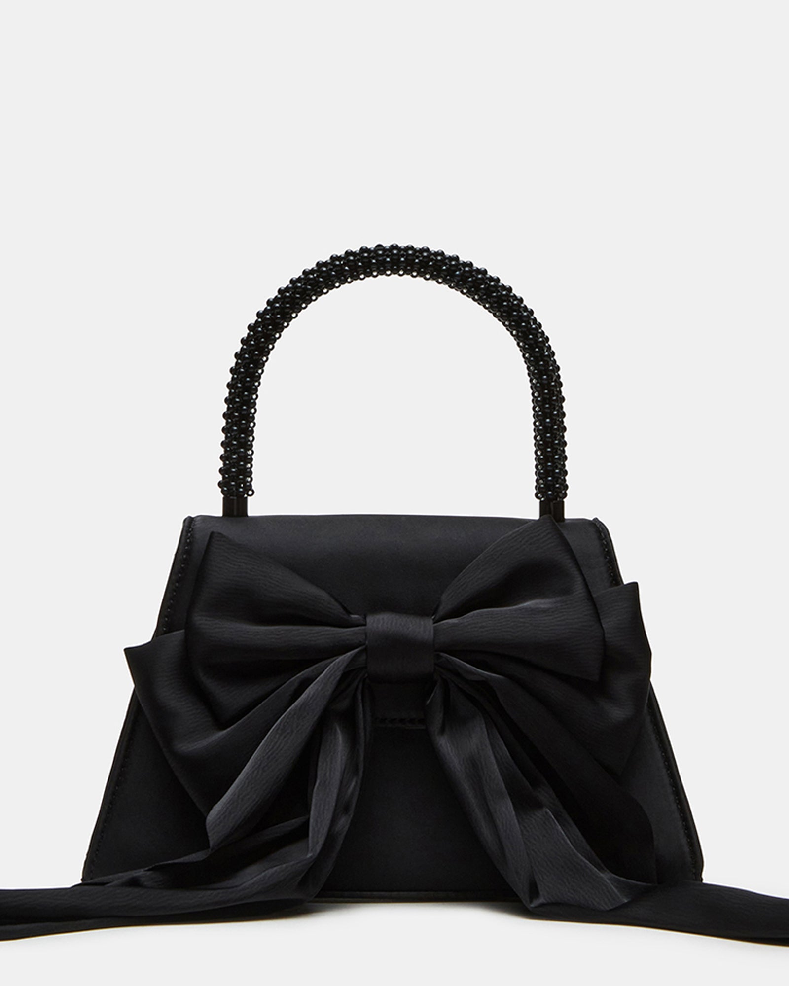 Cosette black satin evening bag displayed on a marble surface with gold jewelry