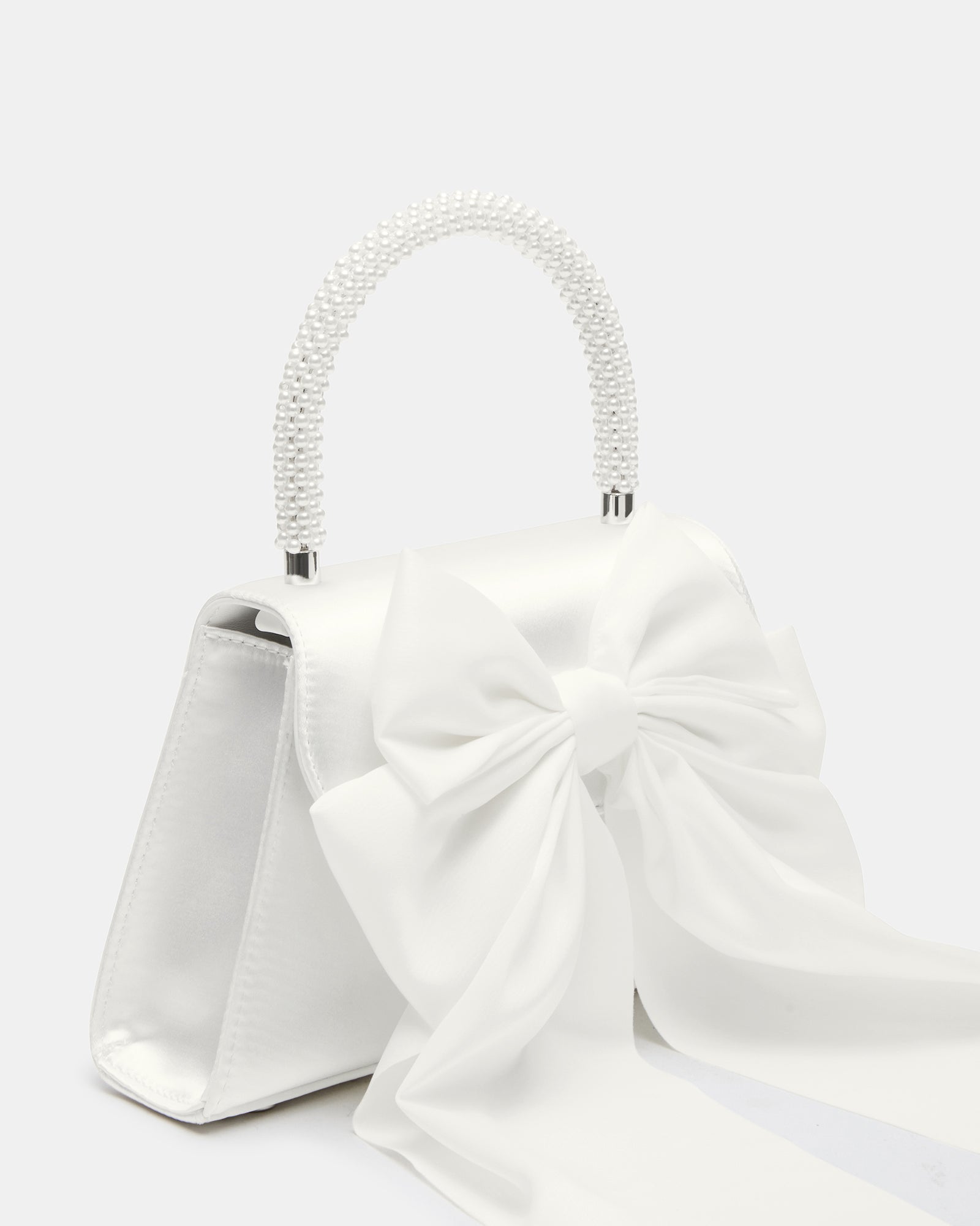 Stylish silver evening bag showcased at a formal event.