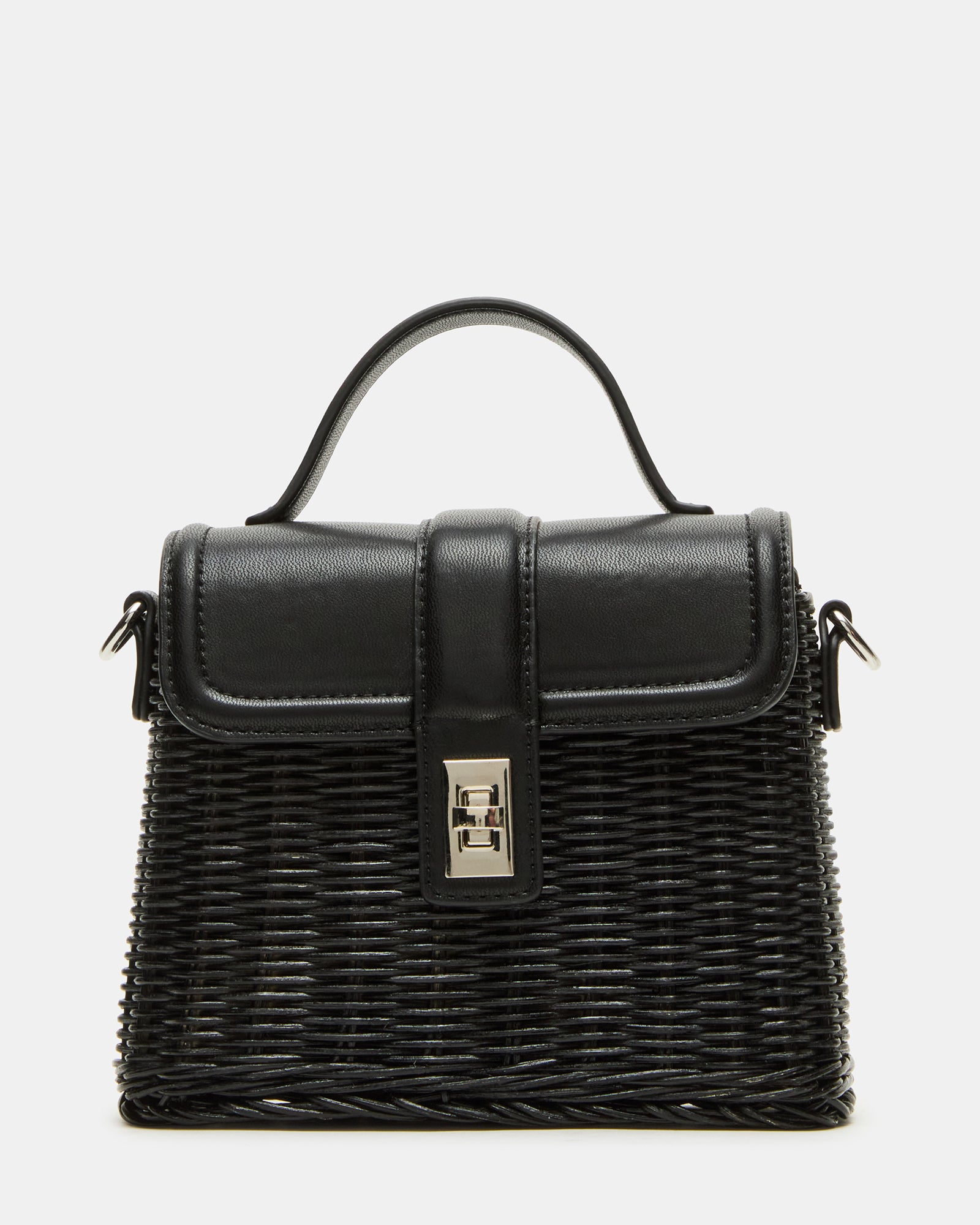 Black Cristy bag styled with a casual summer outfit on a park bench