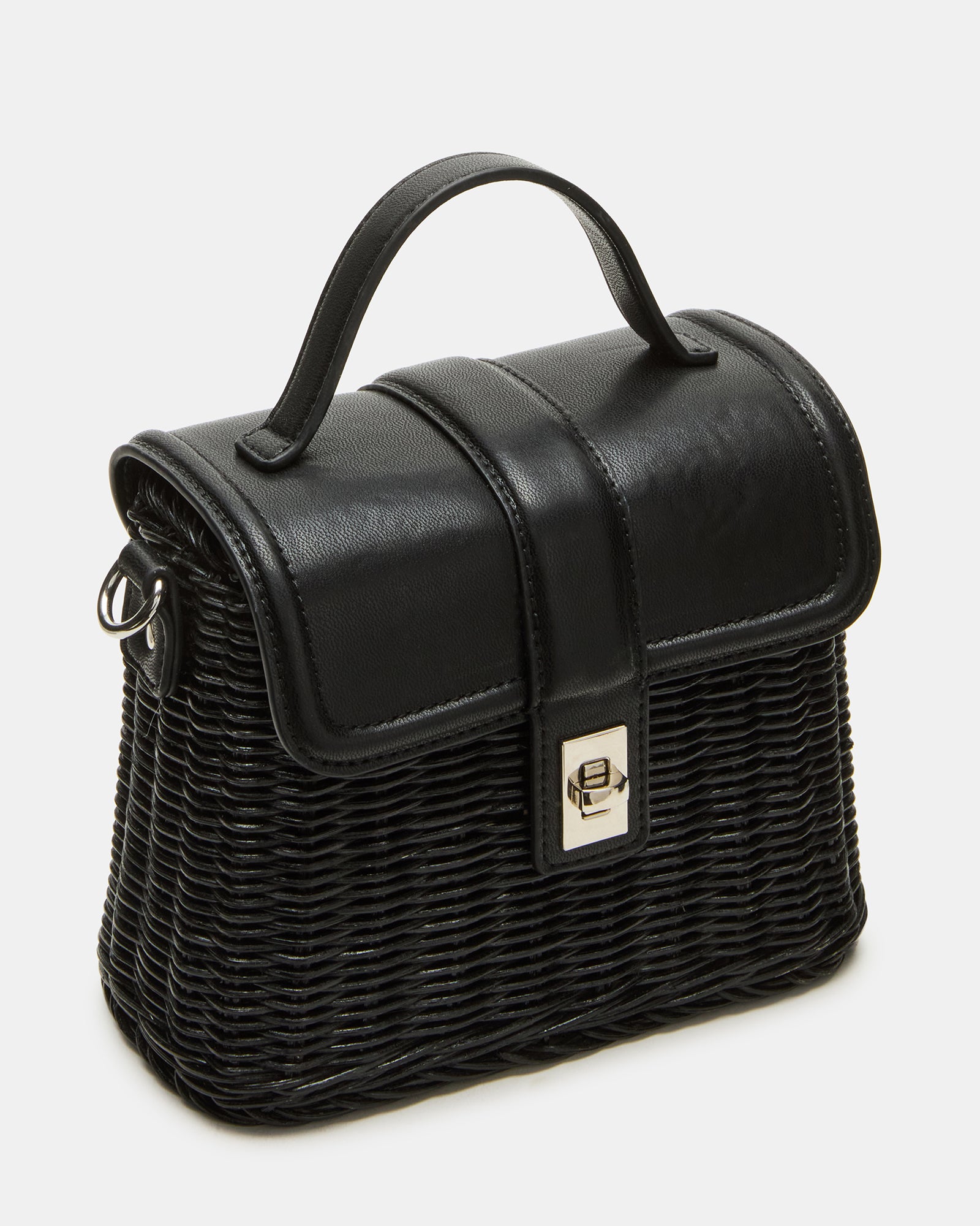 Black Cristy bag styled with a casual summer outfit on a park bench