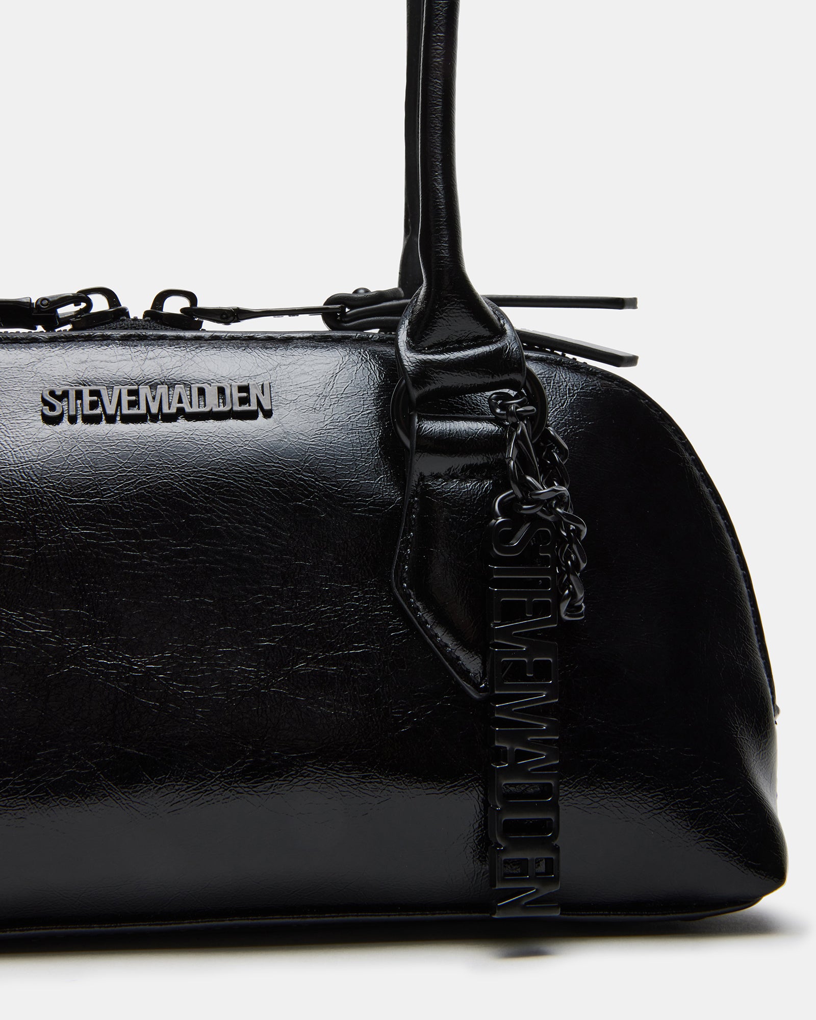 Lifestyle shot of the coach teri shoulder bag being used in an urban setting.